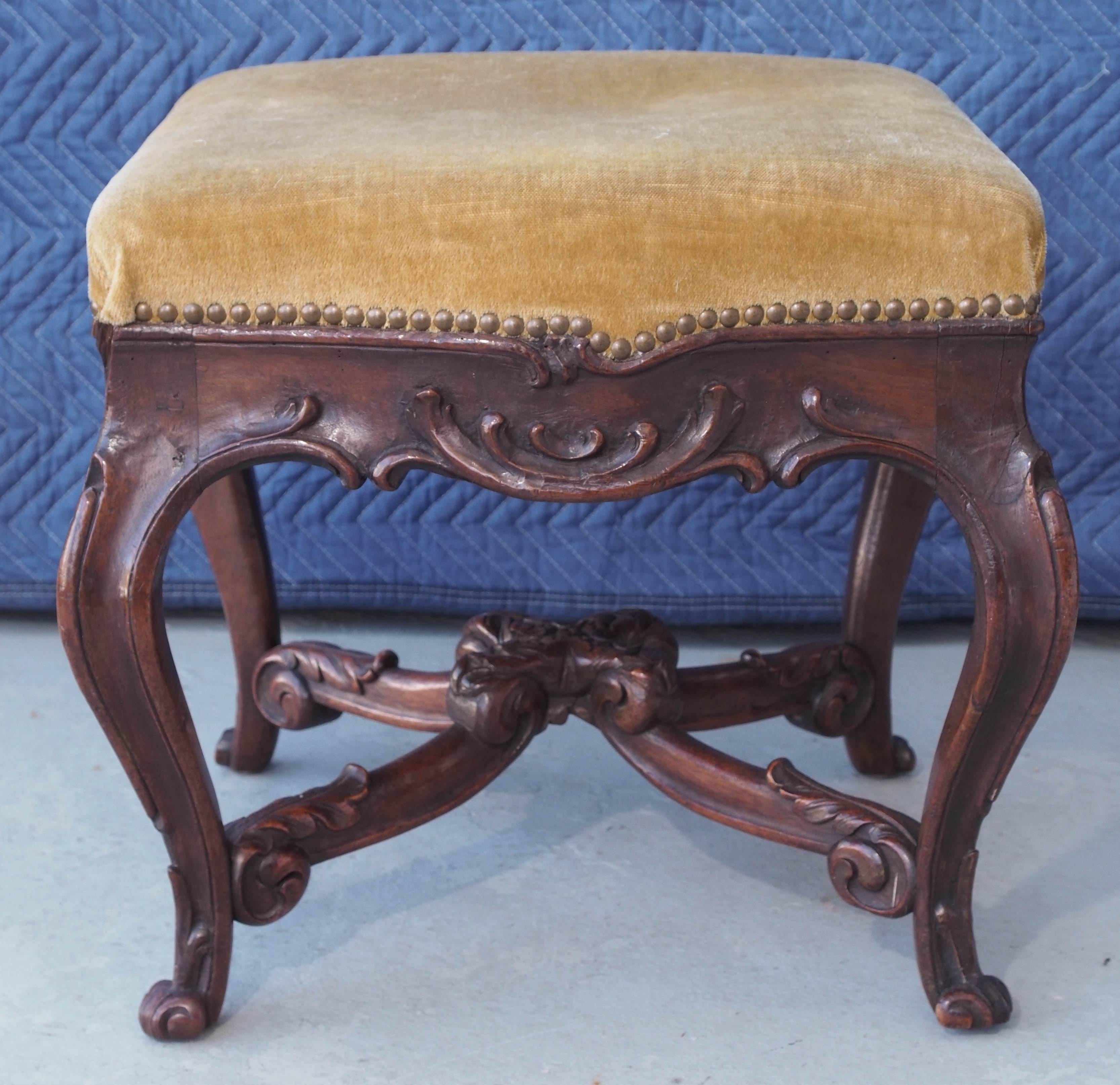 French Louis XV style walnut stool with stretcher.