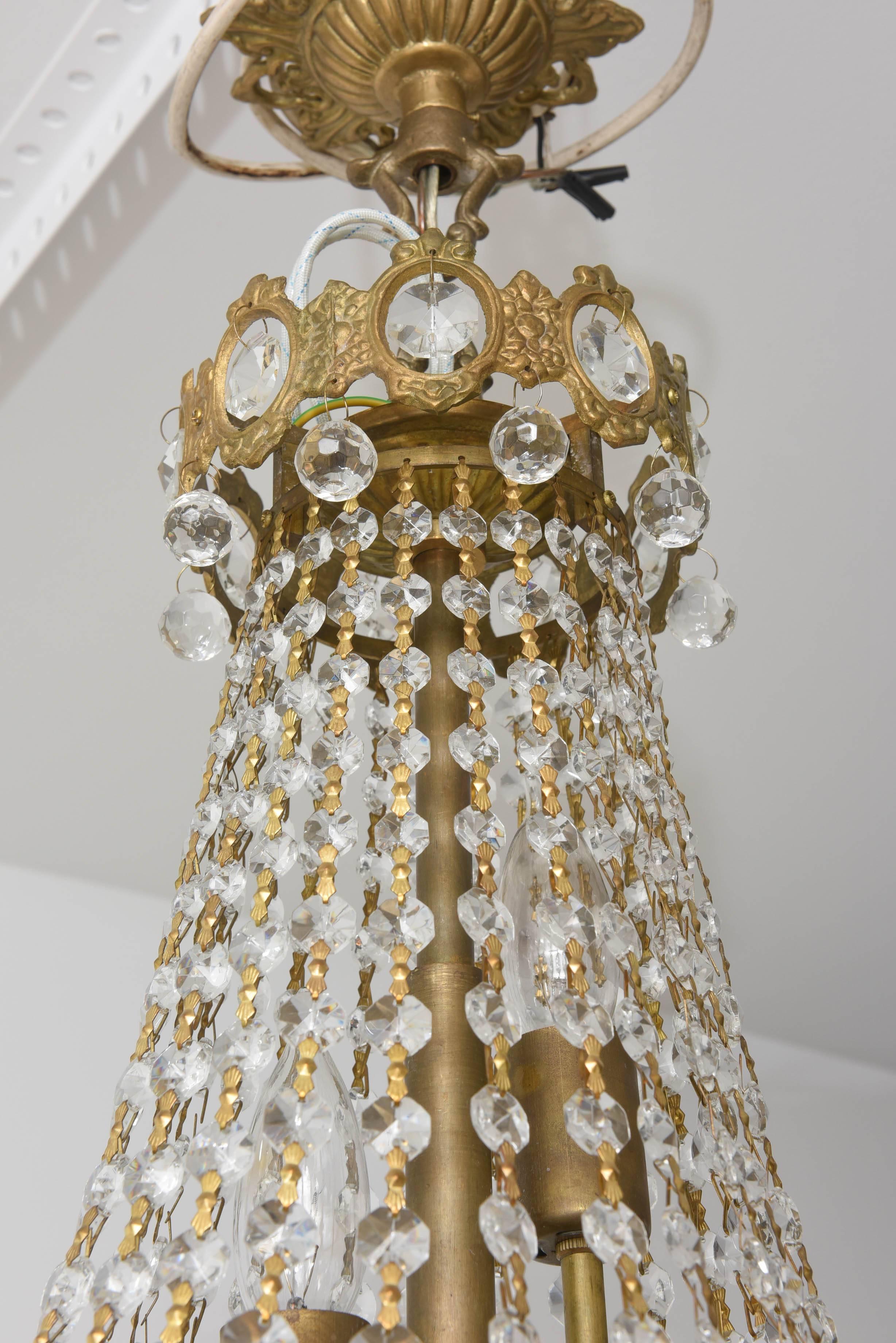 Hollywood Regency, Louis XVI Style Chandelier in Antique Brass and Crystals In Good Condition In West Palm Beach, FL