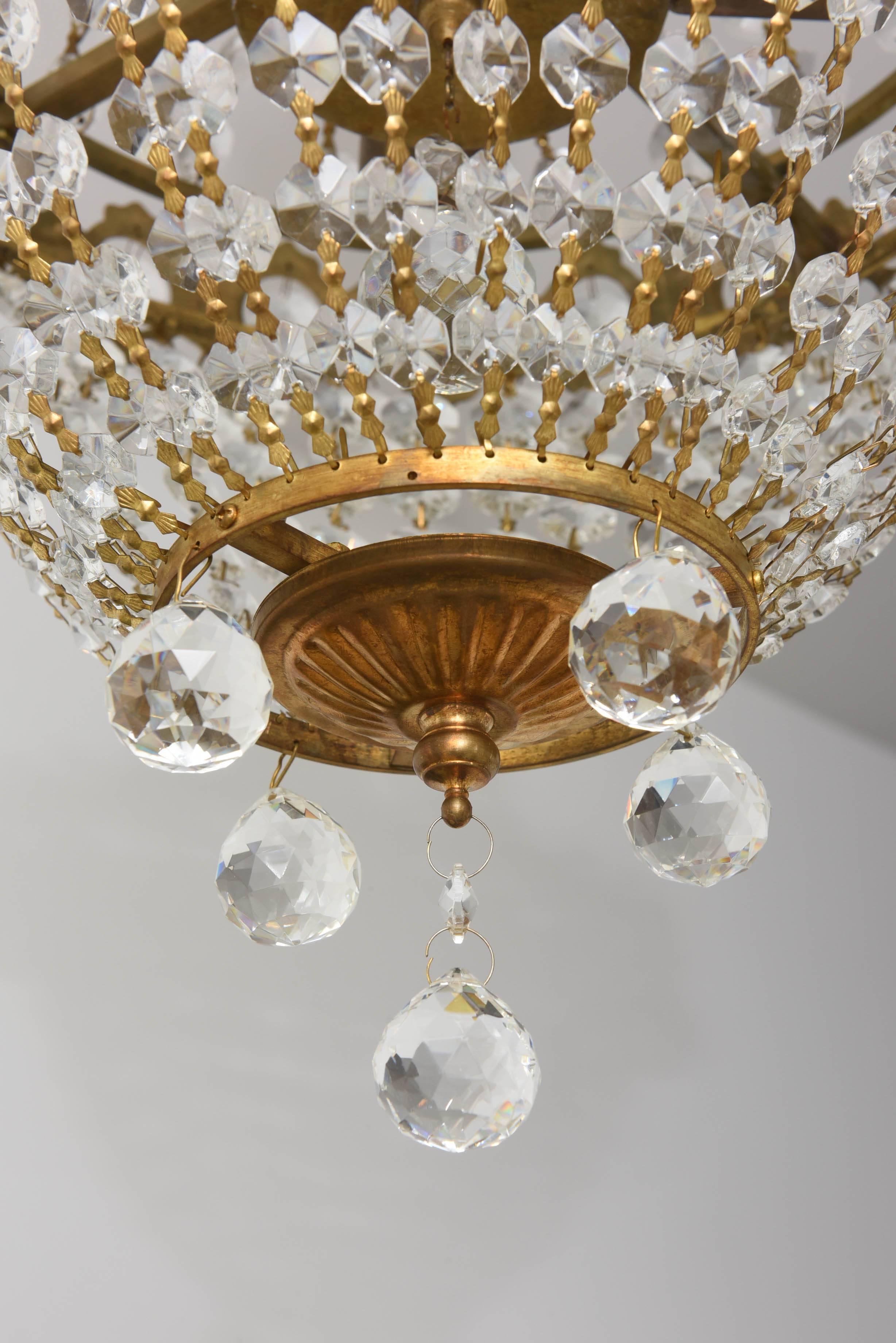 20th Century Hollywood Regency, Louis XVI Style Chandelier in Antique Brass and Crystals
