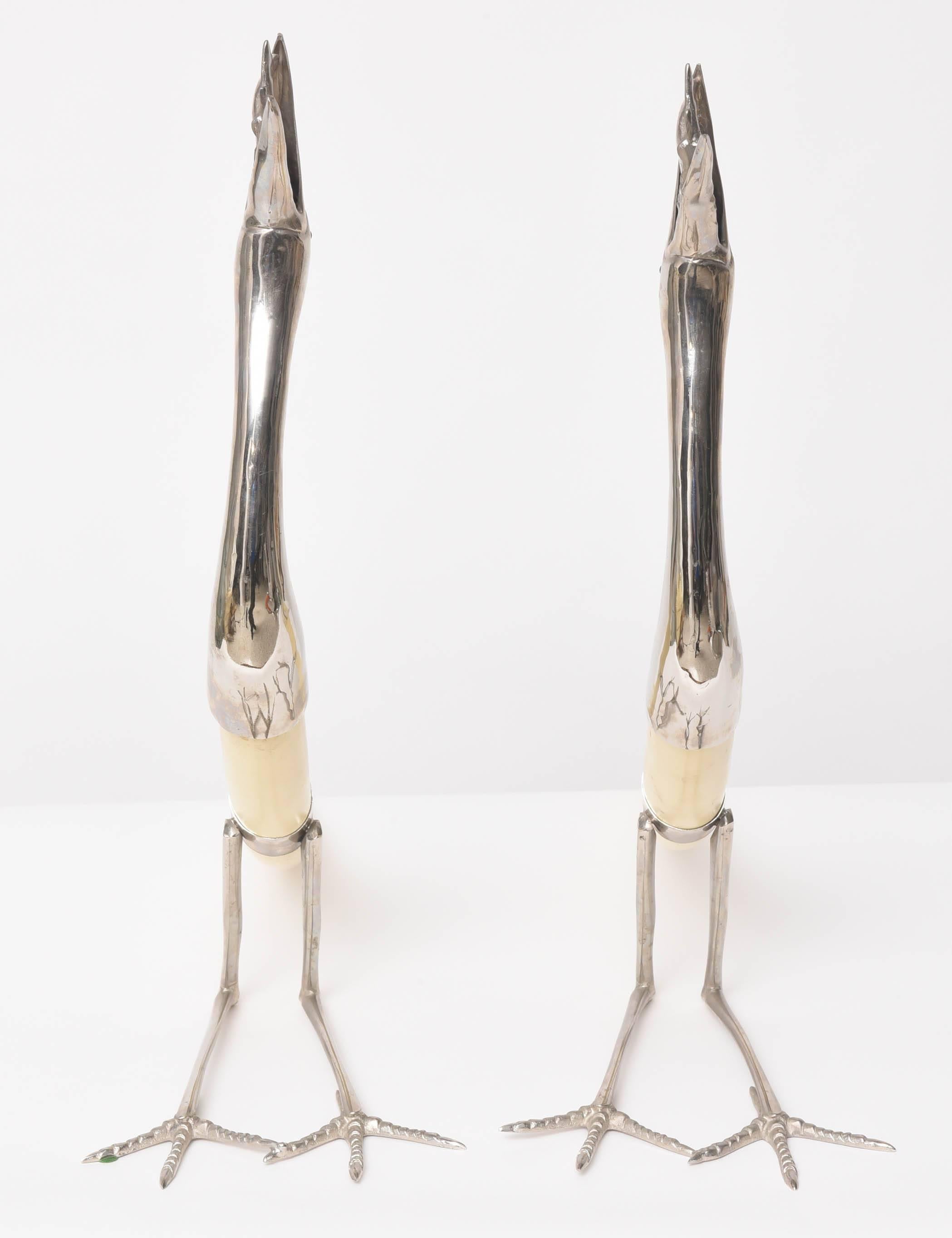 Pair of Hollywood-Regency Silver Plated Stylized Cranes with Fish and Resin Tusk In Excellent Condition In West Palm Beach, FL
