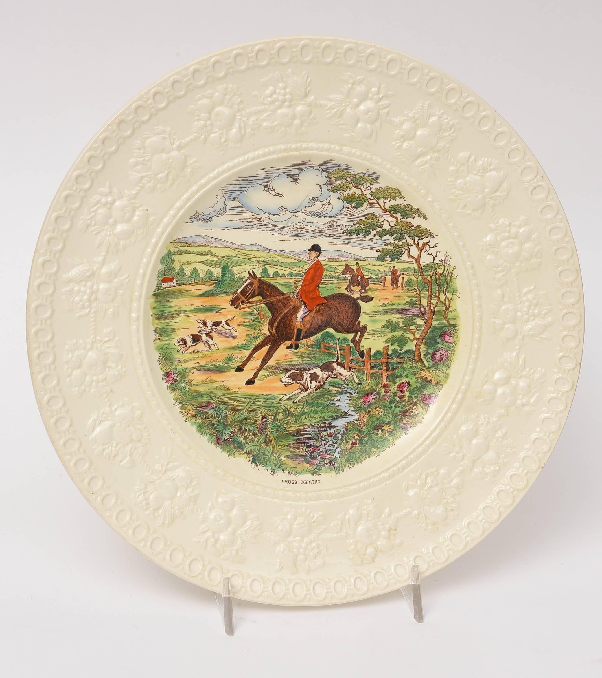 A classic set of hunt plates on one of Wedgwood's textured creamware blanks. A combination of transfer and hand coloring make these perfect for cabinet display or luncheon place setting. These mix and match well in with our other selections of