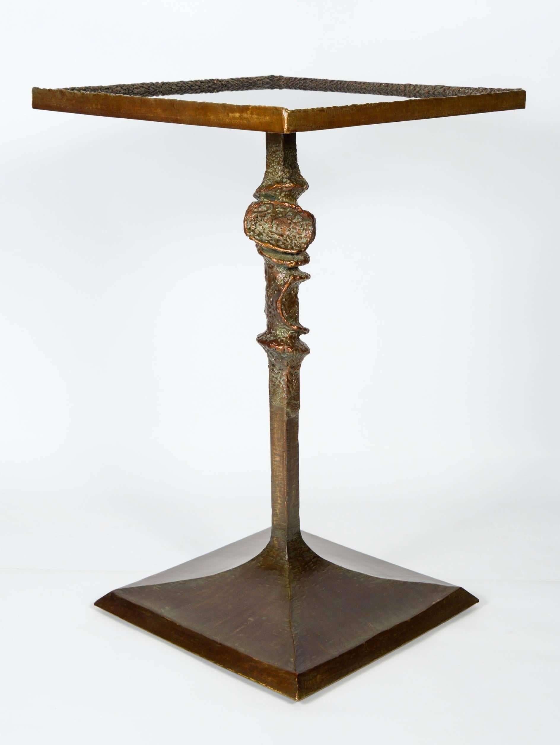 Beautiful Gueridon in the taste of Diego Giacometti, patinated metal and glass.
