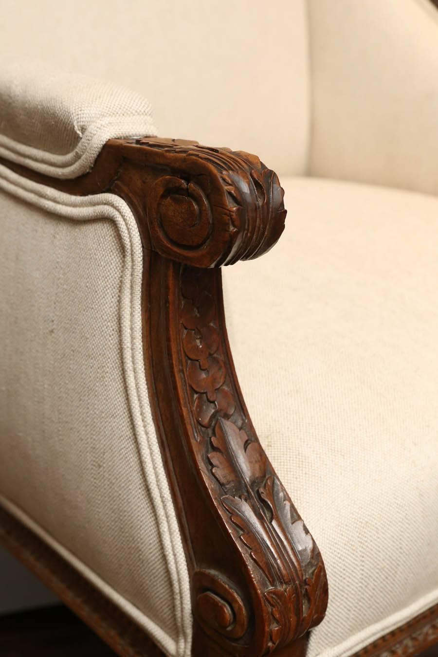 Carved 19th Century French Louis XVI Style Wing Chairs For Sale