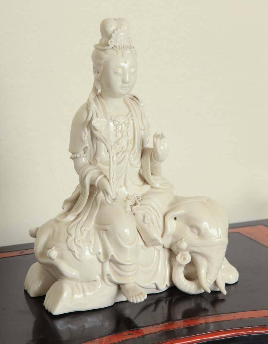 The female deity seated in meditation on the recumbent elephant. The back impressed with the two-character Dehua mark within a double gourd and four-character Boji Yuren mark.