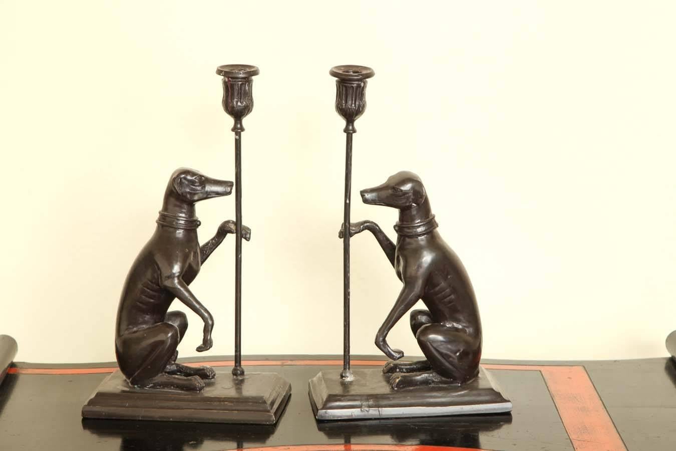 Each featuring a sitting greyhound with one raised paw supporting the candleholder.