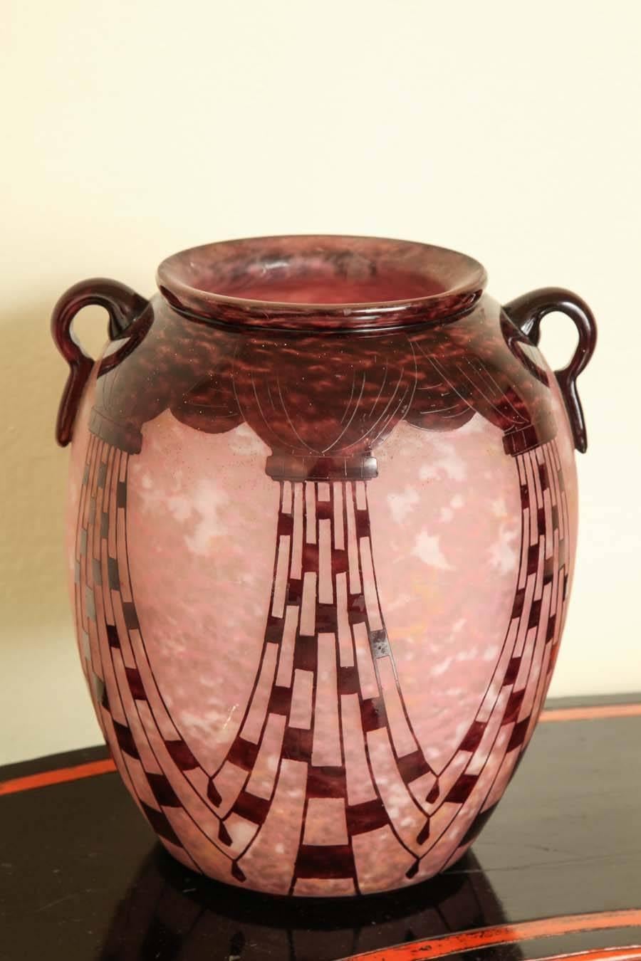 Designed by Charles Schneider, France, circa 1928.
With etched necklace (collier) in deep maroon cameo on a mottled pink and white ground. Signed 