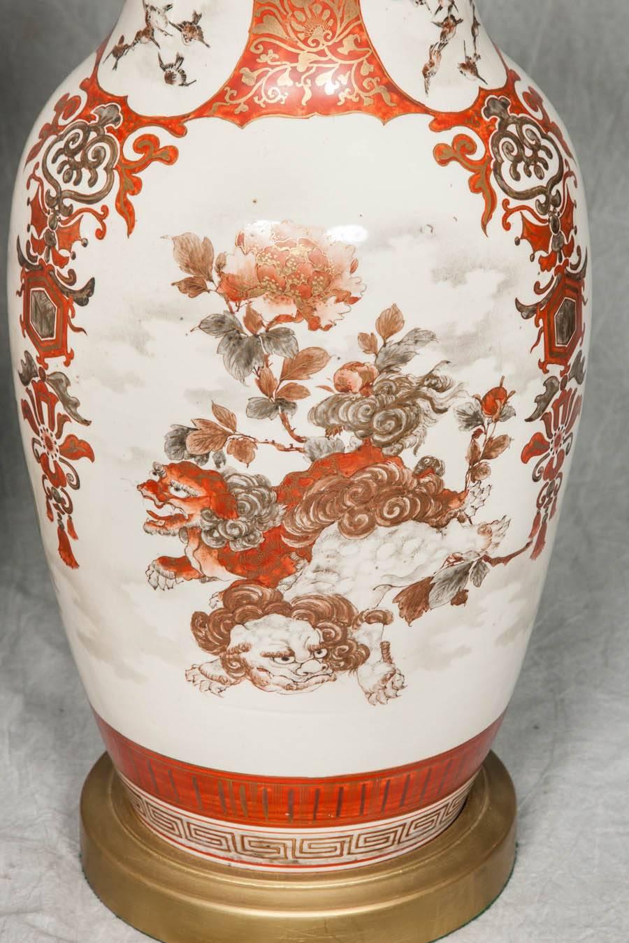 A good quality pair of late 19th century Japanese Kutani vases depicting floral scenes in the Classic orange colors.