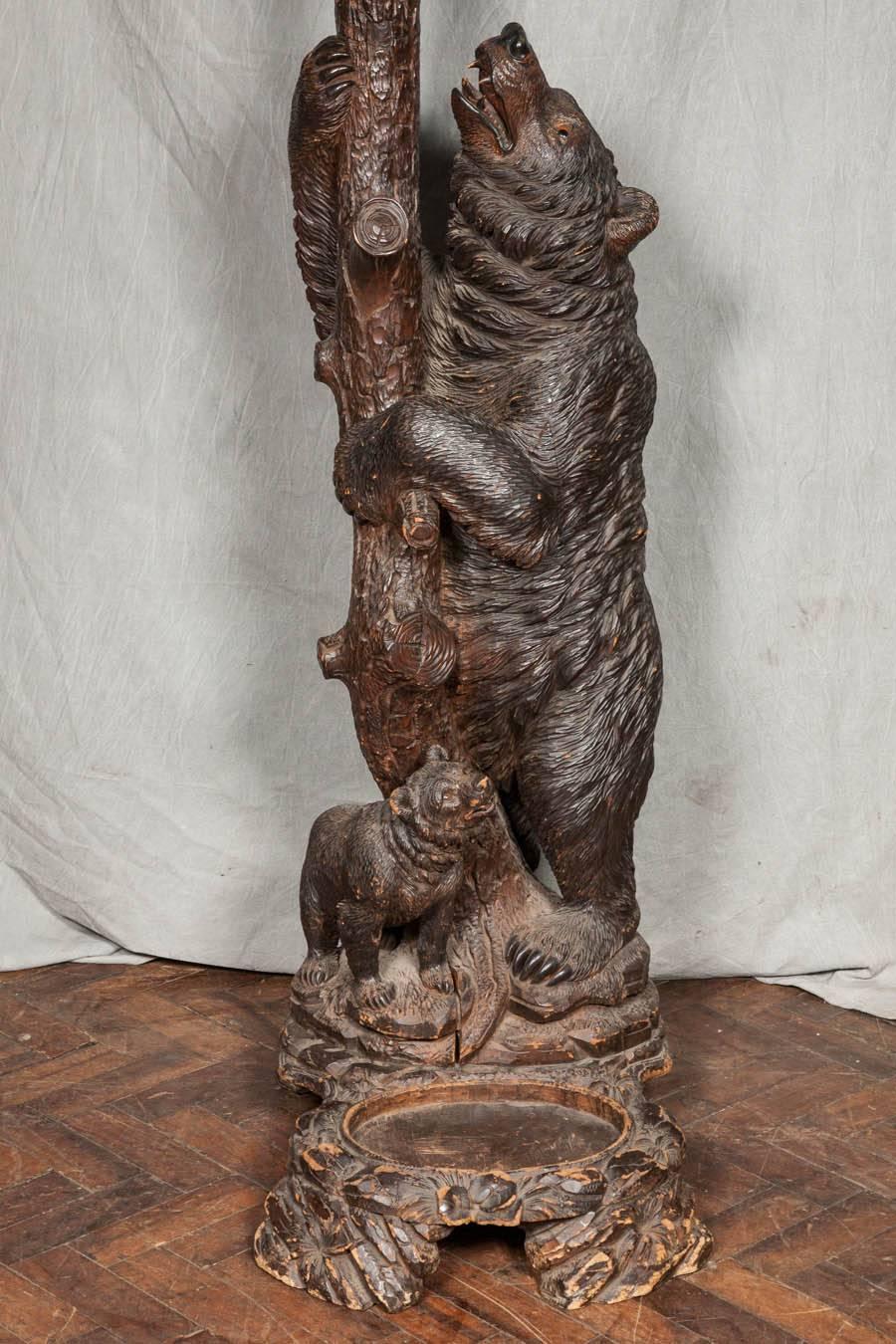 A very good quality 19th century Black Forest hall stand, depicting a mother bear and her cubs climbing on a tree.