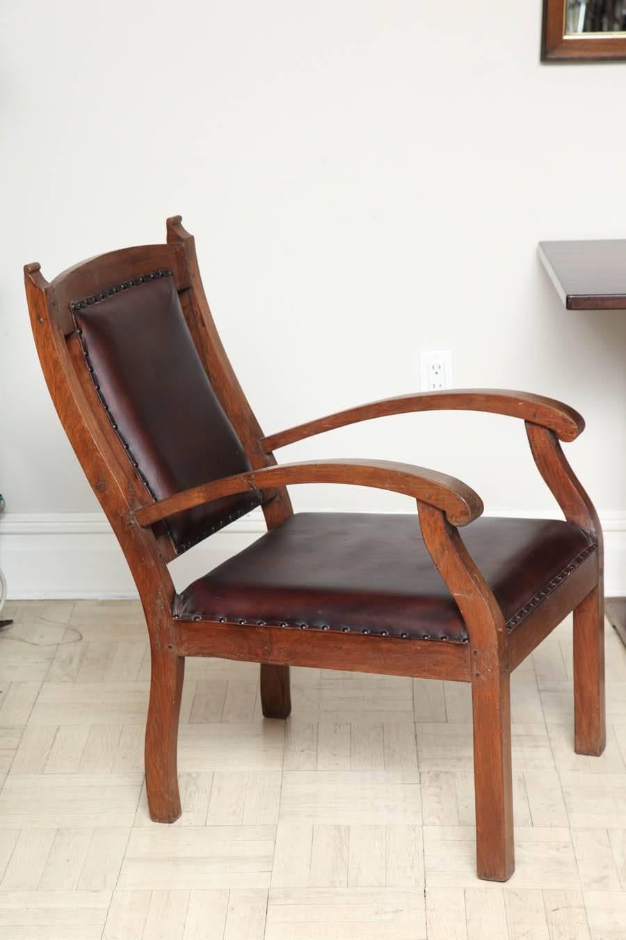 Pair of late 19th century teak armchairs, leather upholstery India, circa 1890.