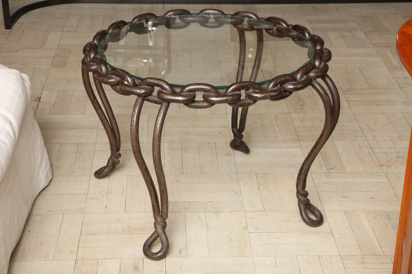 Circular iron link coffee table with glass top, Belgian, circa 1940.