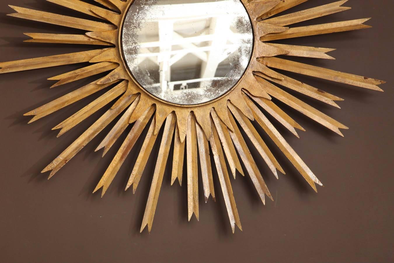 Spectacular MCM large gilt metal sunburst wall mirror. France, circa 1950.

Available to see in our NYC Showroom 
BK Antiques
306 East 61st St. 2nd fl.
New York, NY 10065