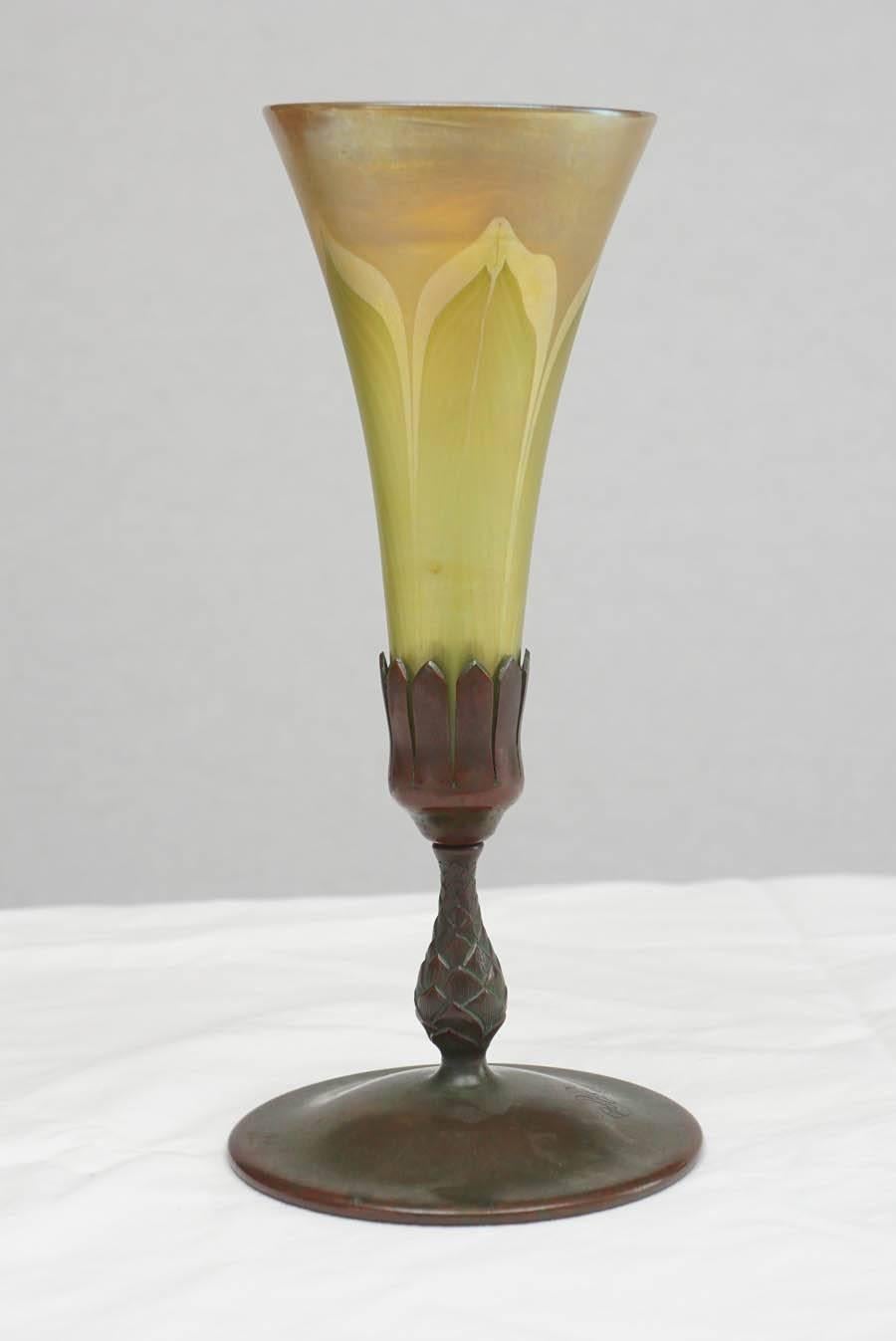 Stunning color on this early 20th century favrile glass vase by Louis Comfort Tiffany. The base is well marked and monogrammed.