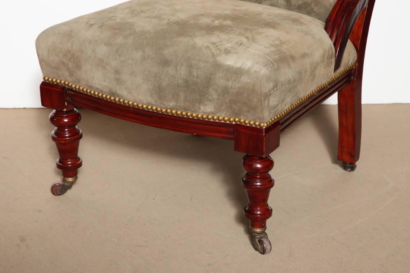 Mid-19th century English, mahogany and suede slipper chair.