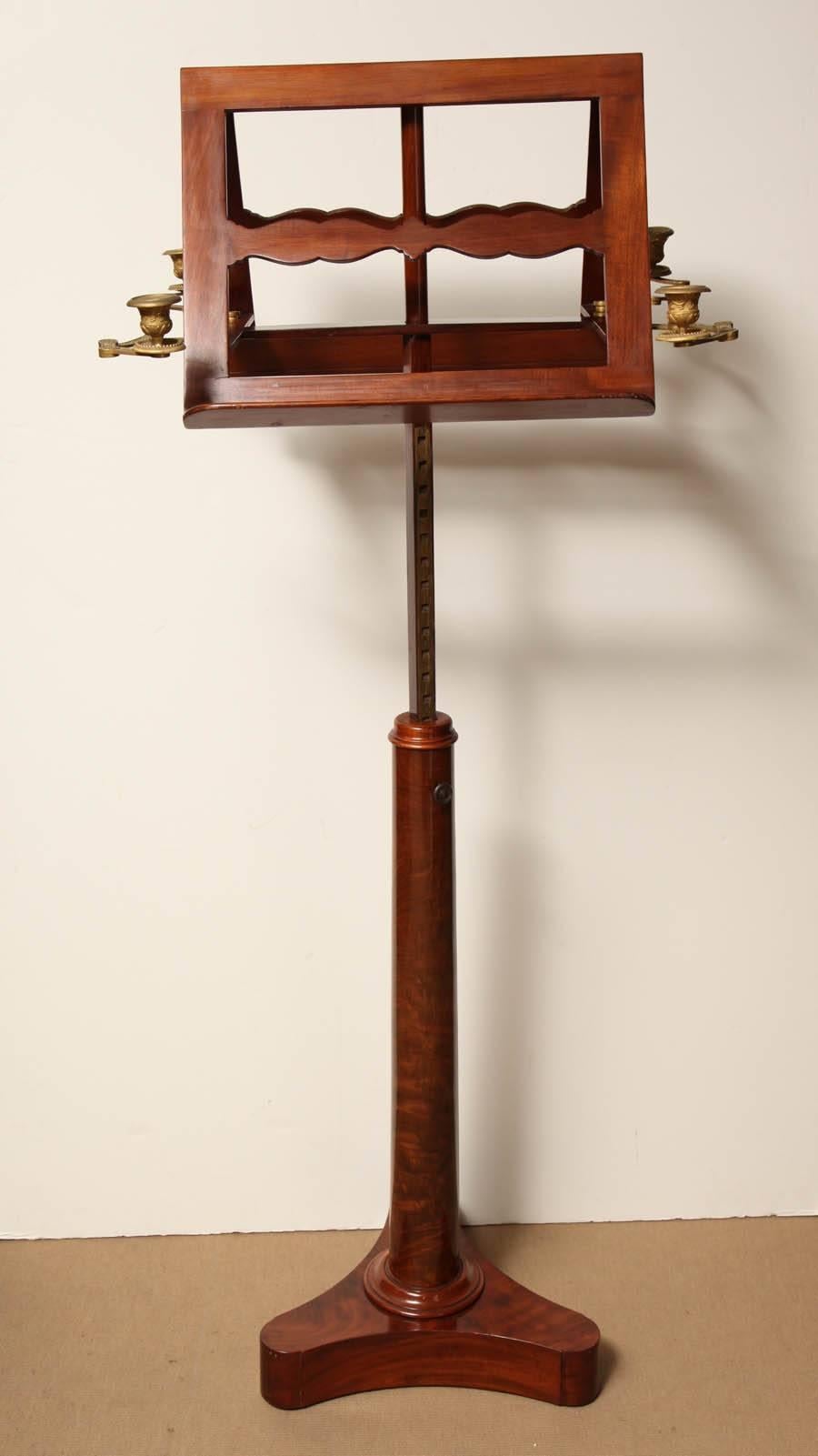 Early 19th century French, mahogany, adjustable height, two-sided music stand with four candleholders.