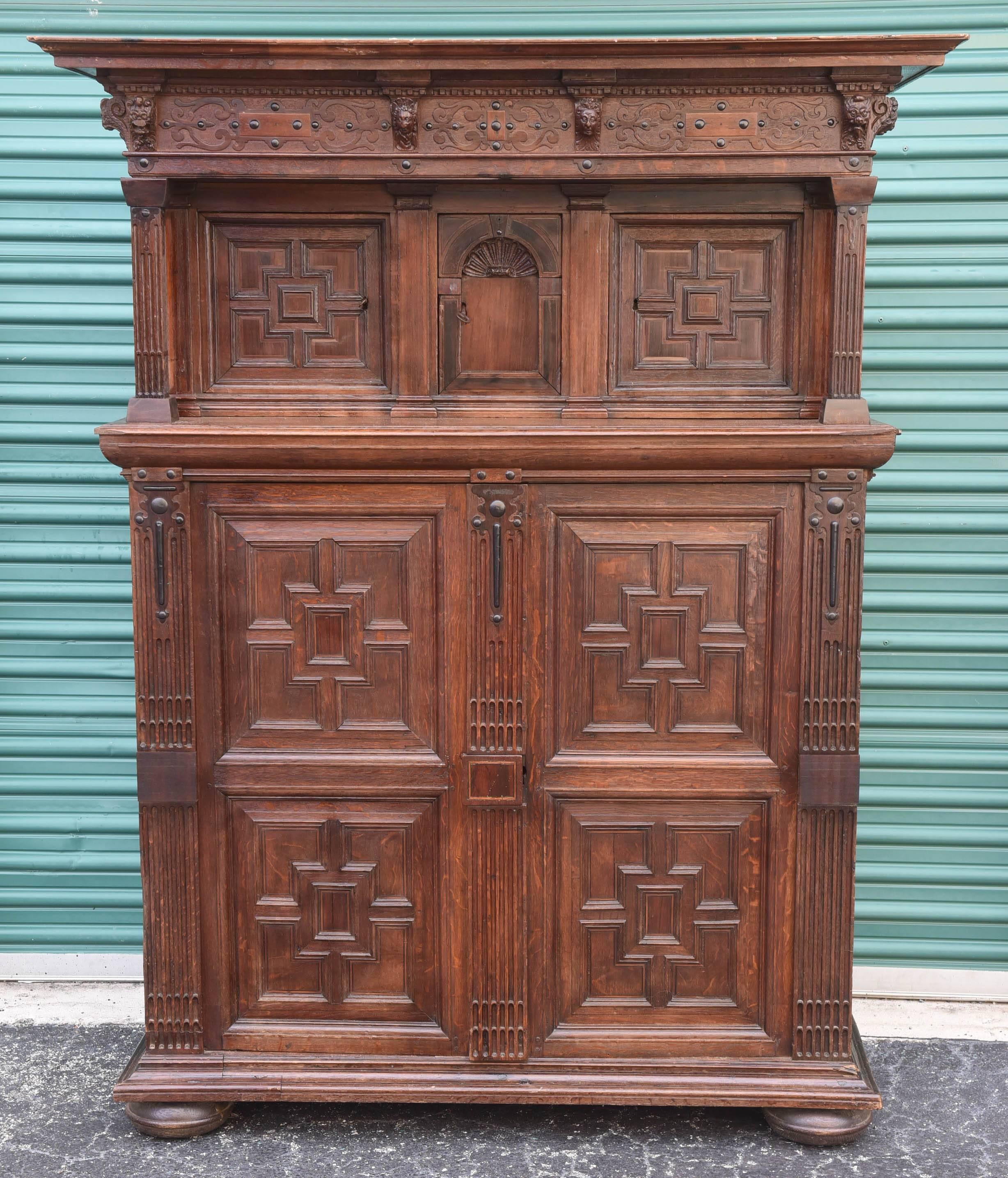 This is a very impressive French oak court cupboard, carved frieze over three recessed doors over two elongated panelled doors, 70