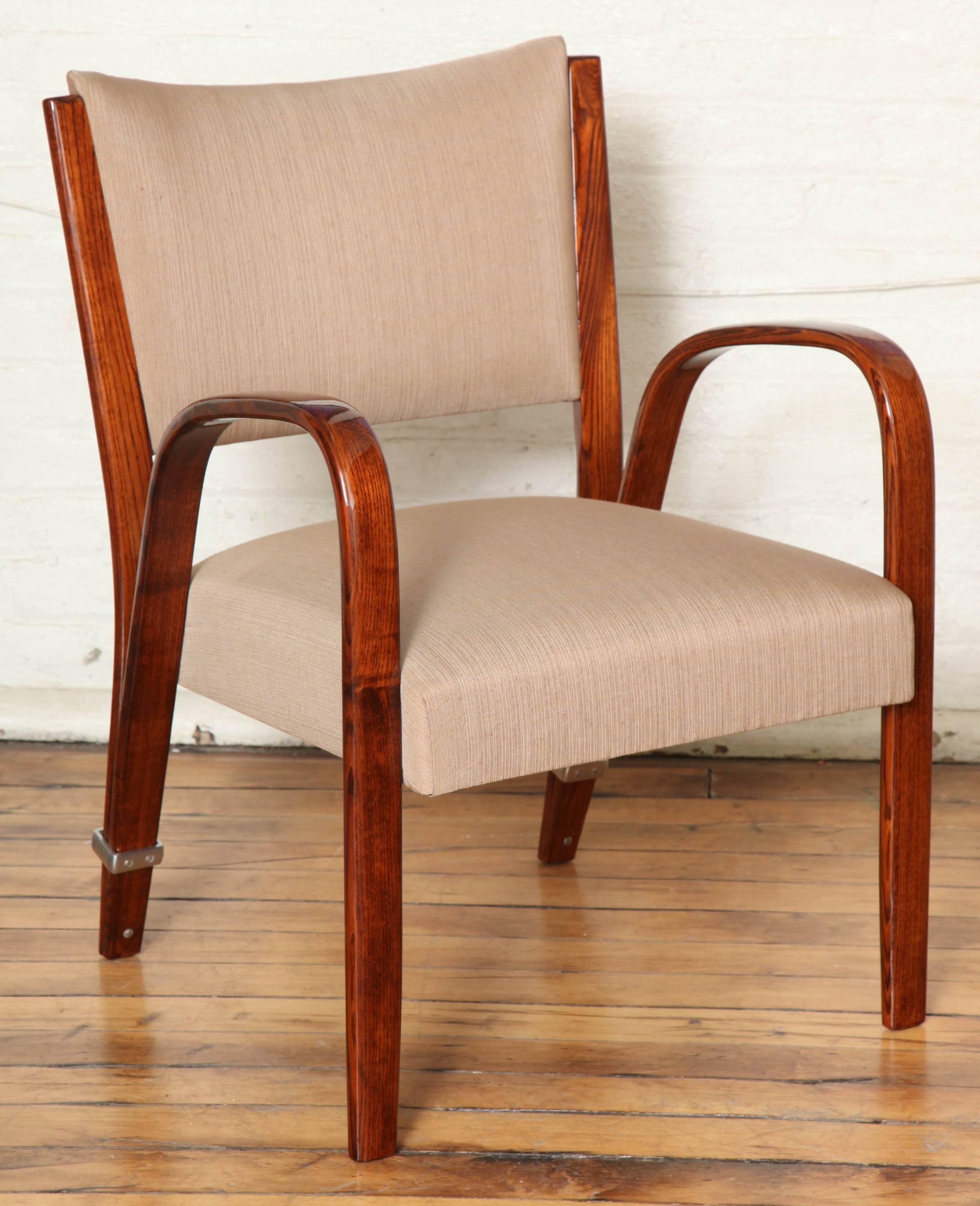 Extraordinary suite of 12 dining chairs and two host or hostess armchairs by Steiner. Unique design in walnut bentwood with metal detail typical to Steiner designs. Chairs are priced and sold individually. Will reupholster at no charge COM.