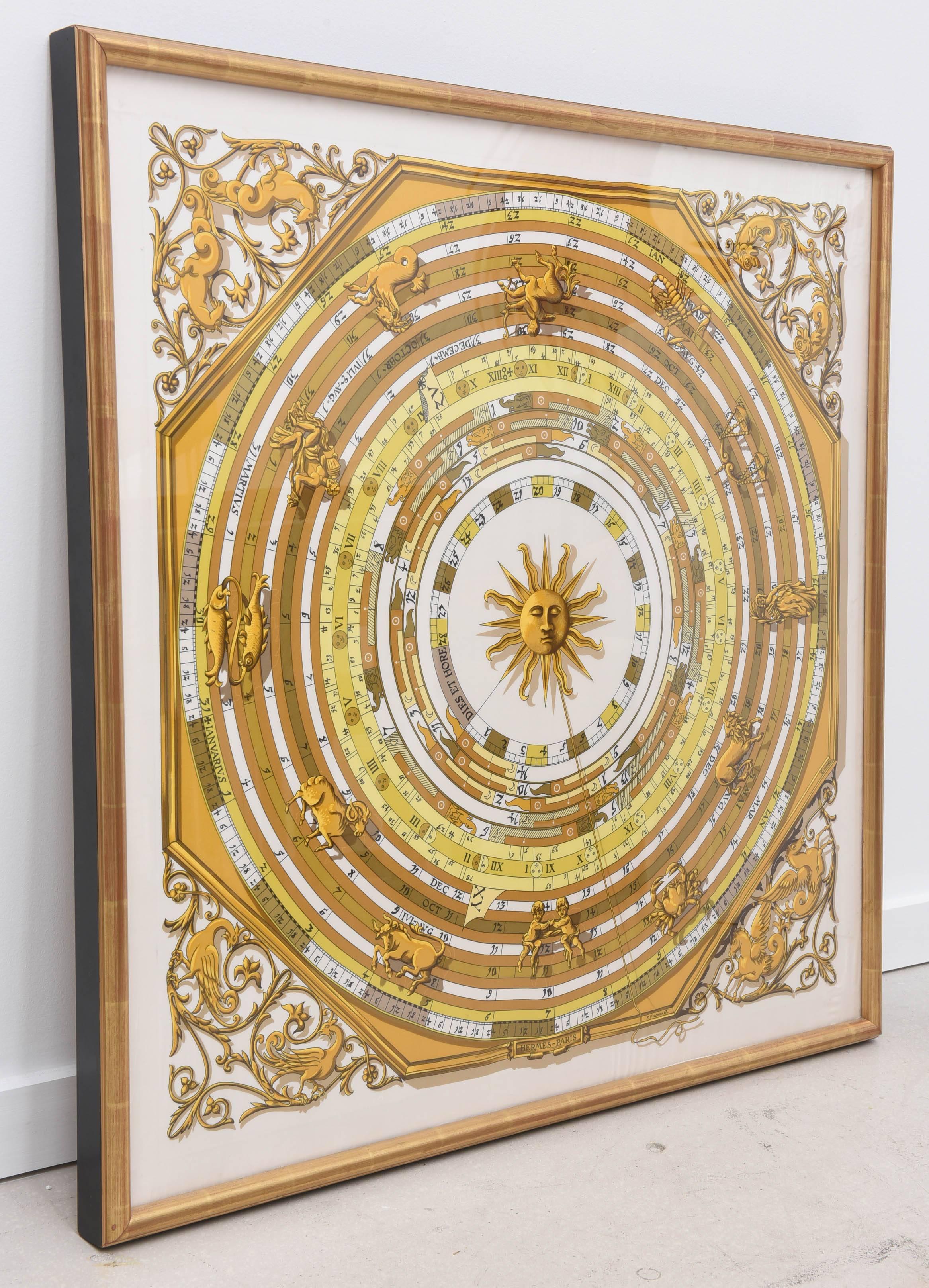 Hermes zodiac sign scarf with center sun motif framed in giltwood frame.