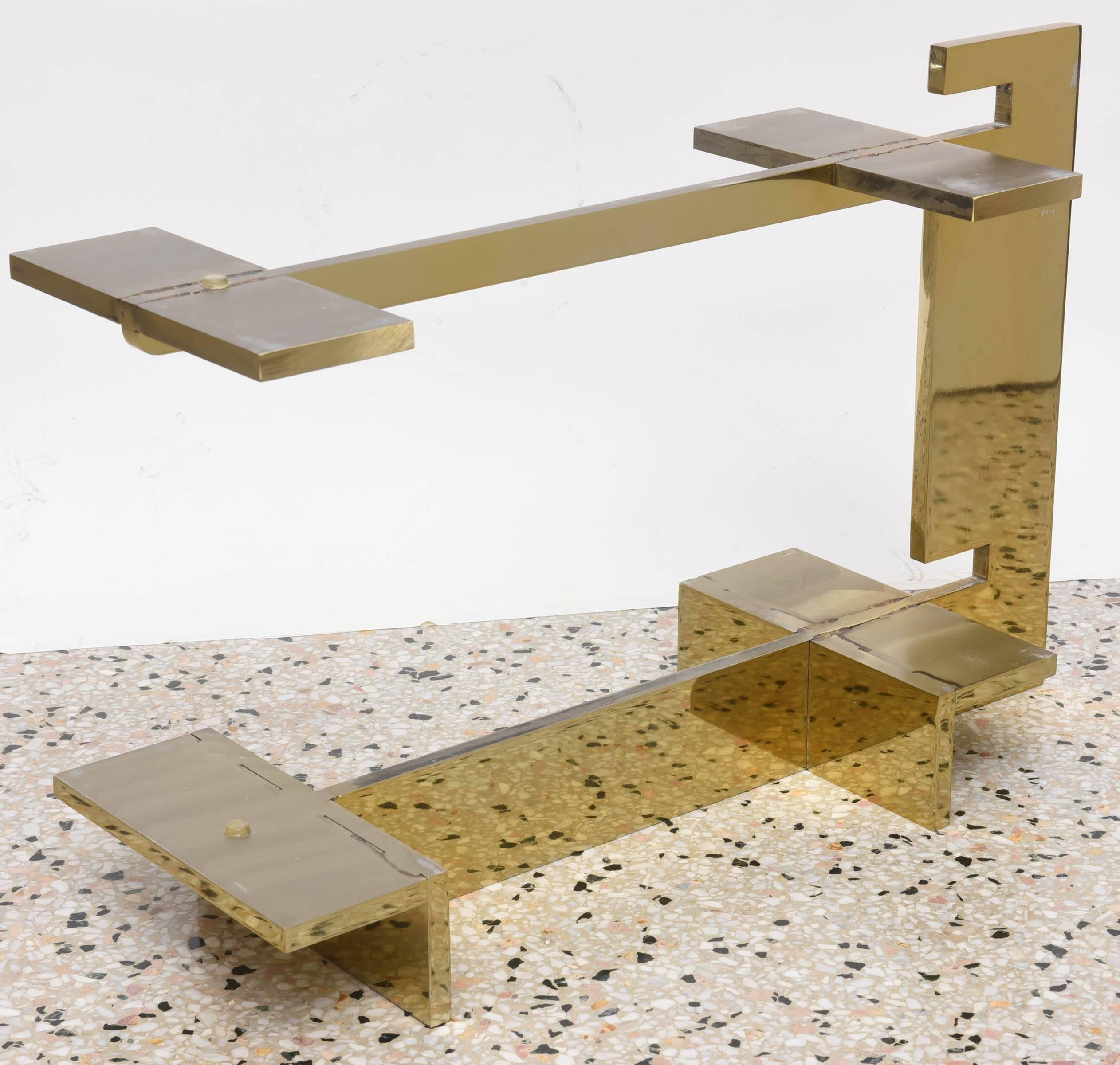 This handsome side table was designed by the iconic furniture designer Milo Baughman and was produced by DIA (Design Institute of America) in the 1970s.

The piece is brass-plated steel with two shelves of polished travertine marble in a