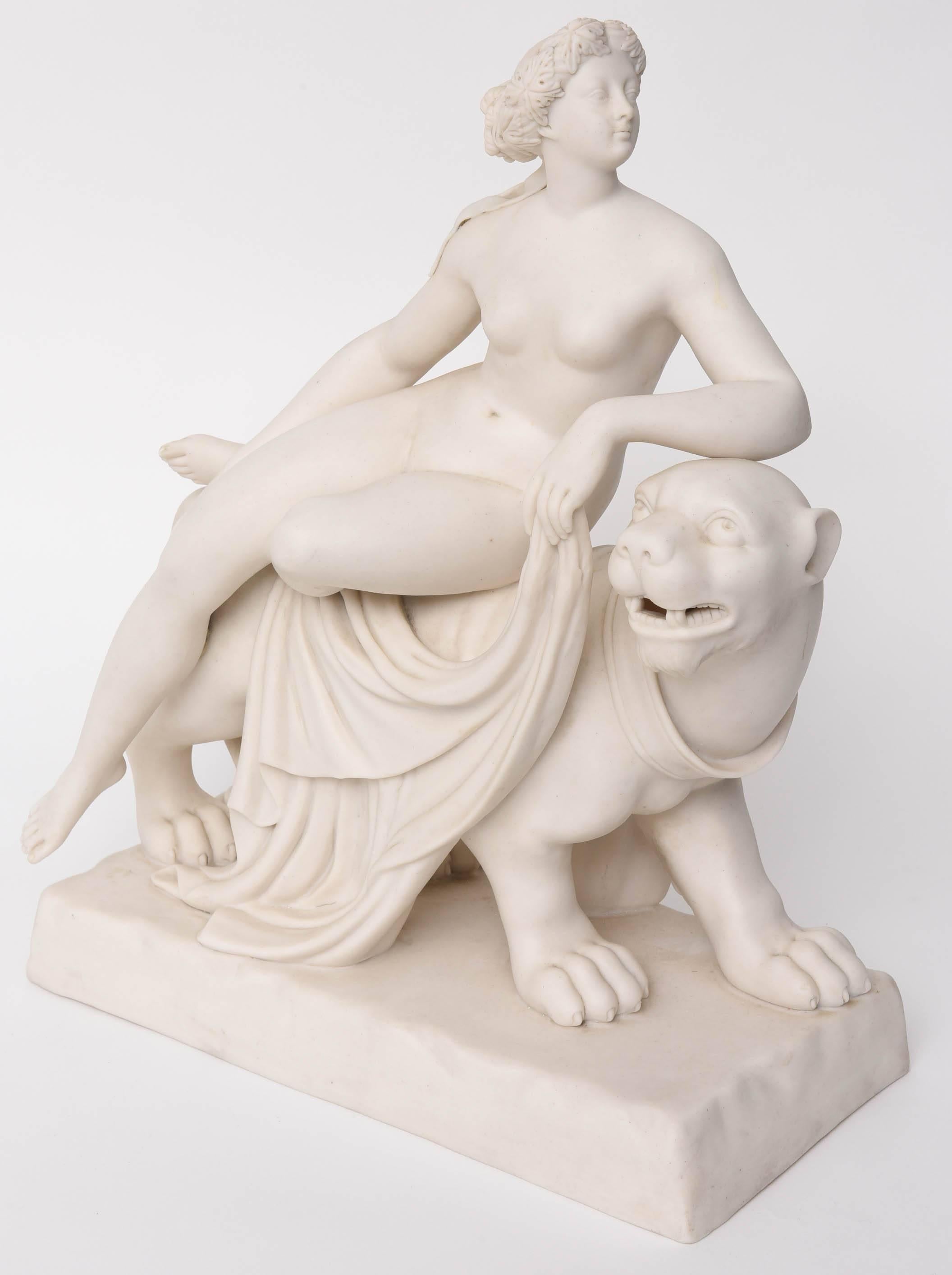 Minton Group 'Ariadne on a Panther' a Parian-ware figure of Ariadne reclining nude on the back of a stylized panther, moving towards the right; she wears an acanthus wreath on her head, her left leg tucked beneath her right, holding drapery in her