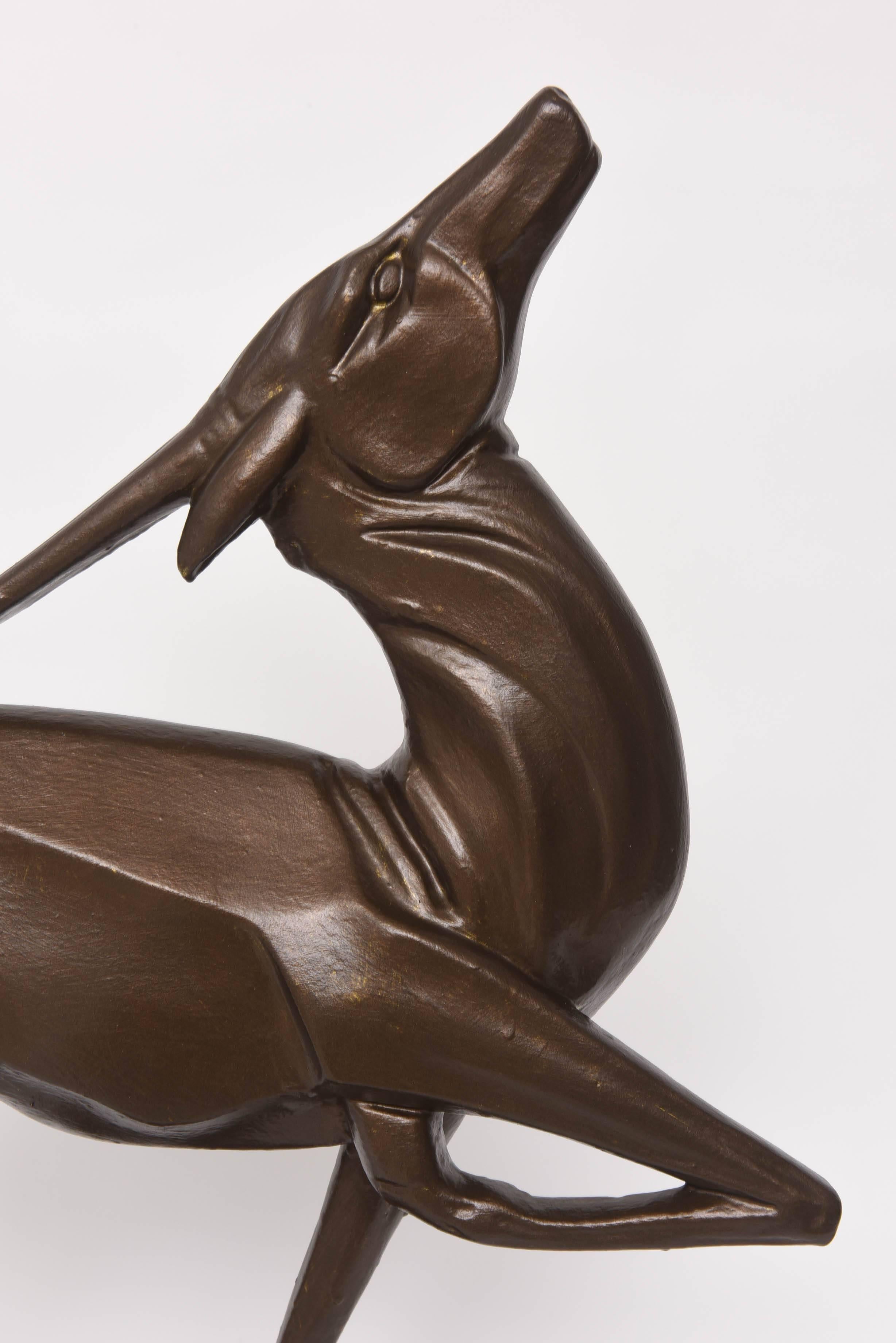 This American Art Deco sculpture is from the 1930s and will make the perfect statement piece. The gazelle with is angular form and patinated faux-bronze finish plays beautifully with the light giving the piece movement and grace.

