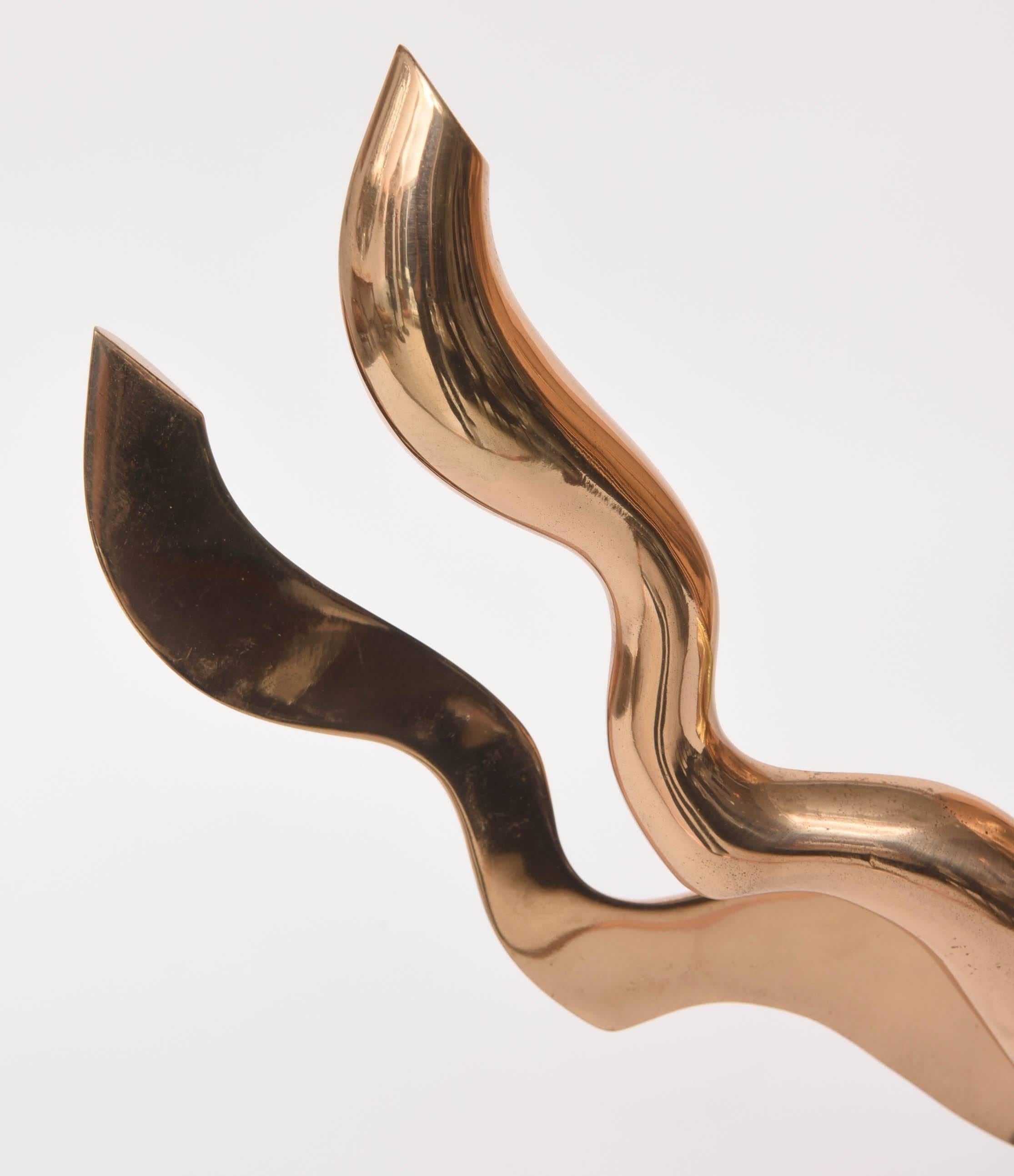 This stylish modern mixed-metal sculpture was acquired from a Palm Beach estate.

Note: The two curved-arms move and can be adjusted in-place to your liking.

Note: The piece is unsigned.

