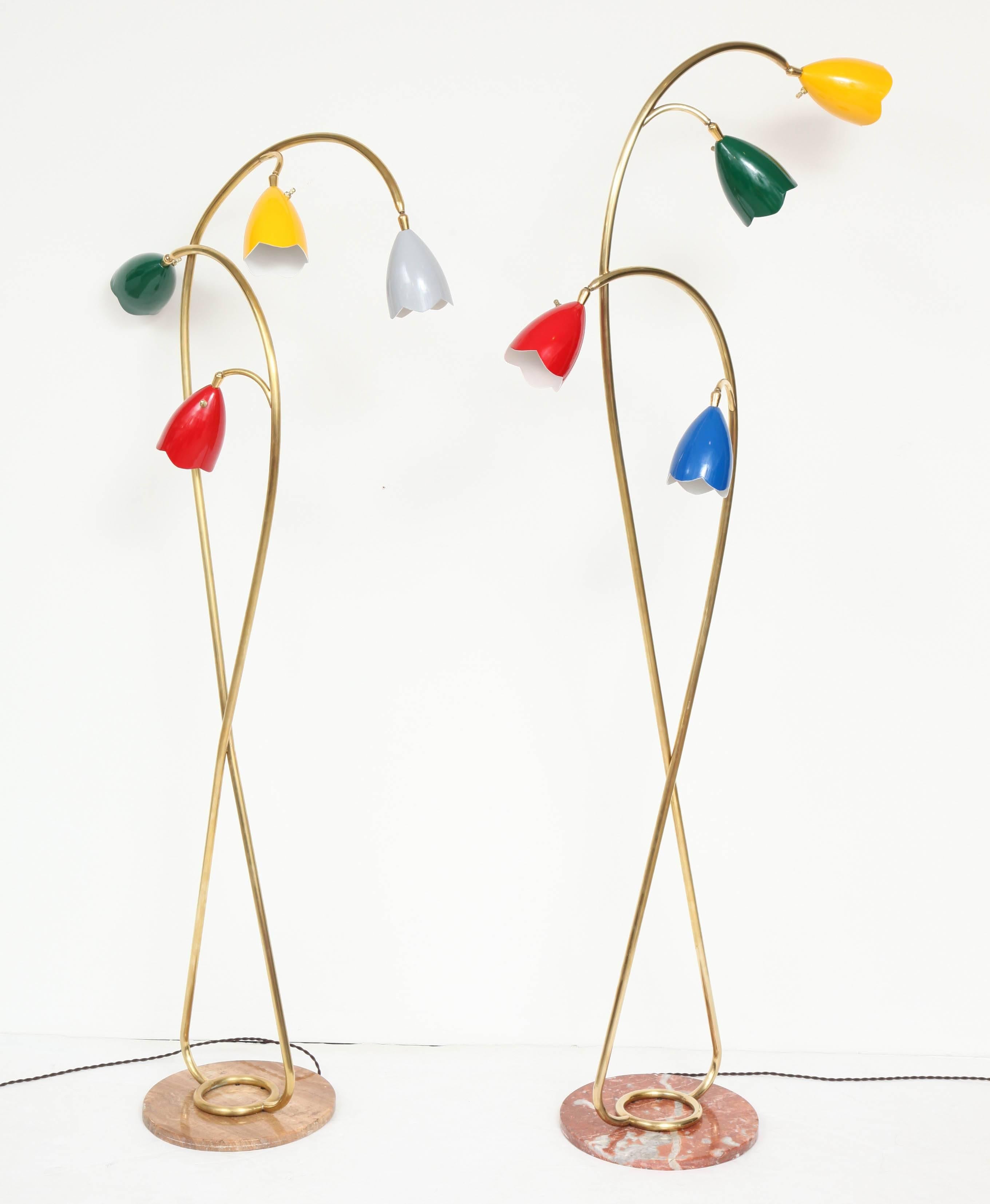 Striking and unusual pair of vintage Italian floor lamps from the late 1950s. Attributed to Arredoluce Monza. Double brass scrolling tendrils reach up from their round polished onyx bases like glorious florae. Distinctive Arredoluce flower shaped