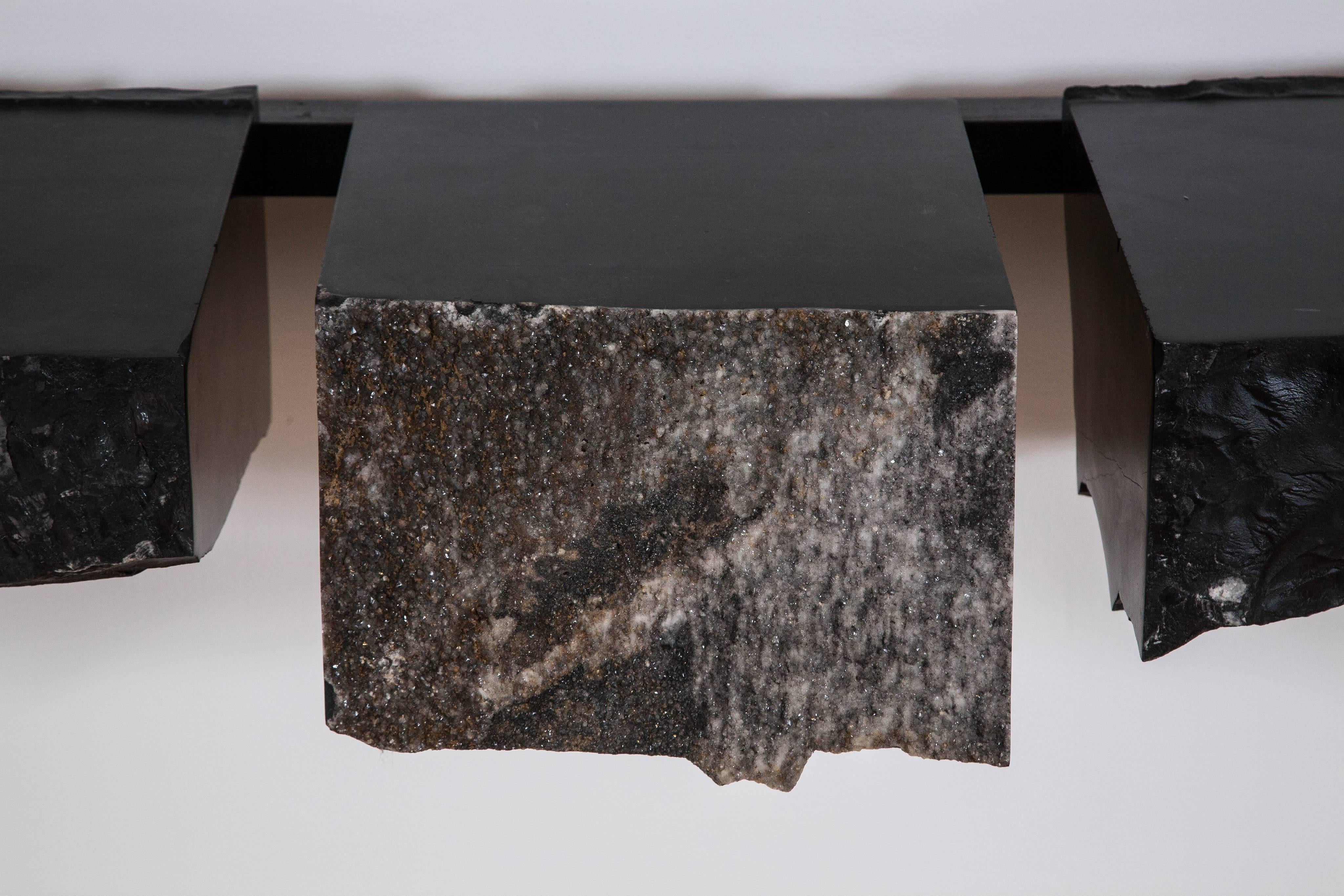 Stunning, monumental console by Belgian artist Gerard Kuijpers, unique piece.
The patinated steel frame supports three elements of rough hewn solid 'Noir de Mazy' marble, quarried in Belgium. 
Each element is secured by steel rods fixed to the