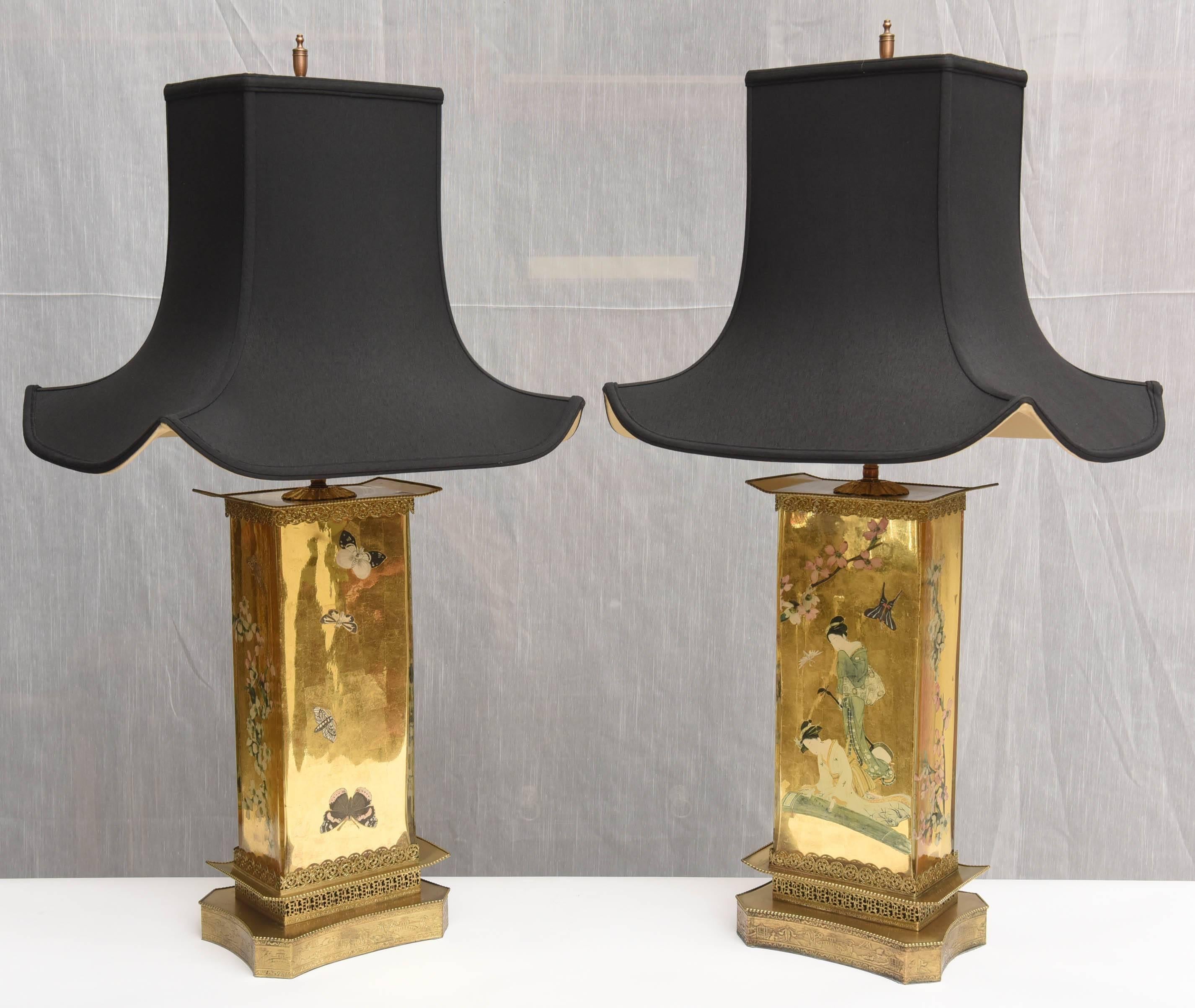 Unusual pair of glass lamps Anglo Japanese style Aesthetic Movement design. Art and Crafts. The body of each lamp is in a gold leave under glass with Japanese figures. Bronze base and bronze top, American, 1900. Electric system recently redone. New