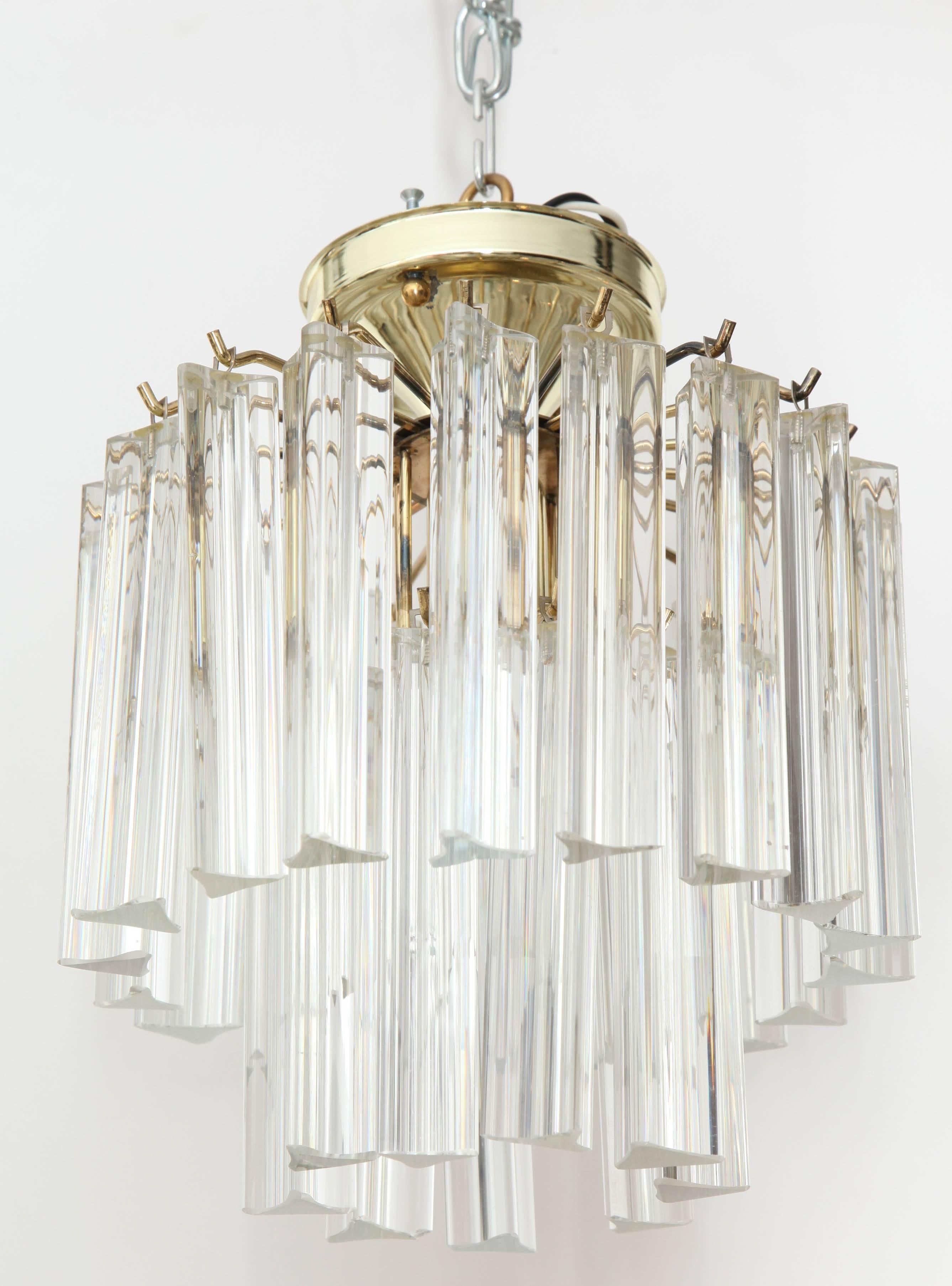 Two-tier crystal flushmount lighting fixture on a brass frame. Uses one central Edison type bulb. Wired for use in the USA.