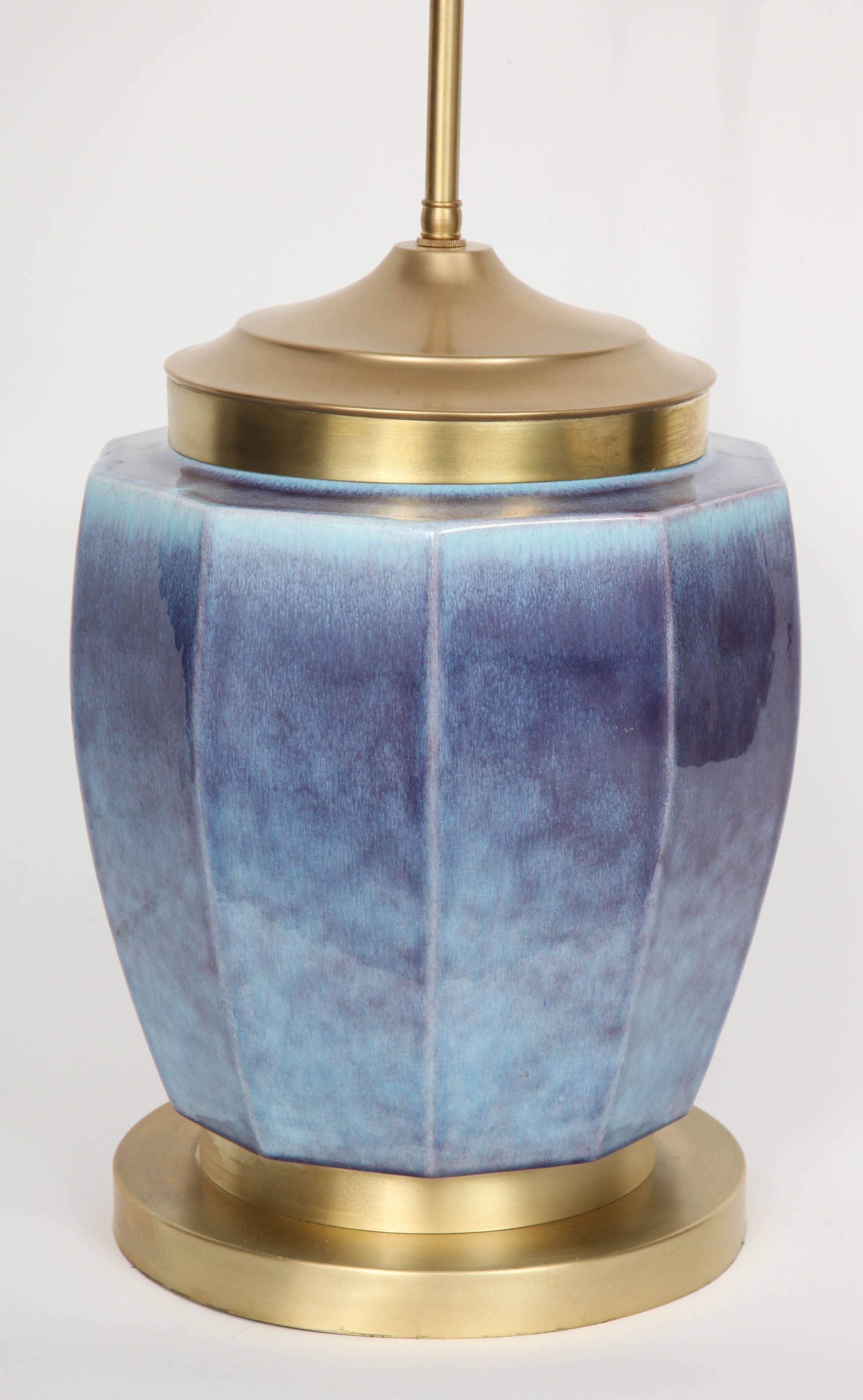 Large-scale Mid-Century ceramic lamp with subtle fluted perimeter in a striking mottled glaze in tones of violet and periwinkle blue. The large lamp sits on a satin finish brass base and has been rewired with a double pull chain socket.
