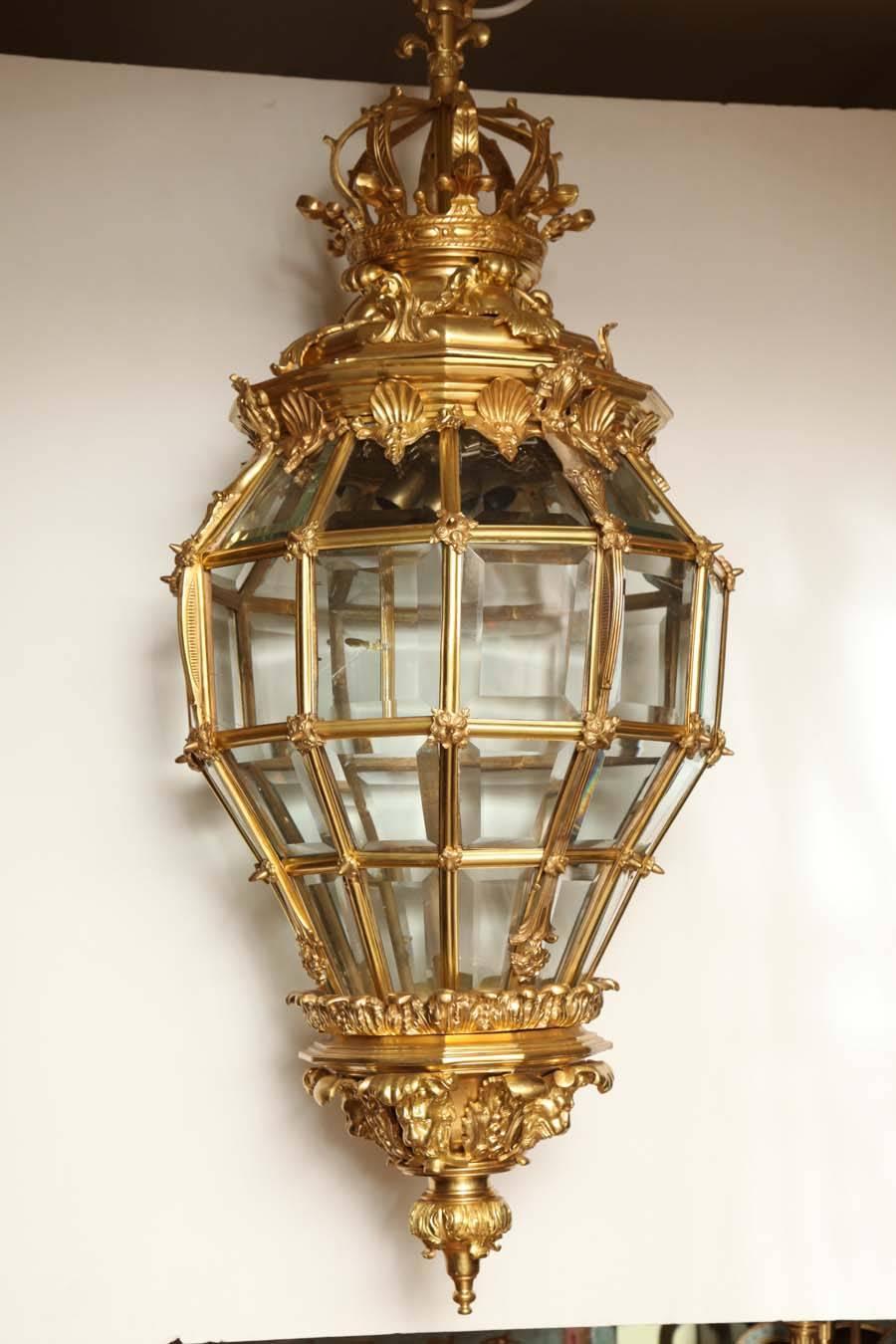 A fine French gilt bronze dodecagonal hall lantern with bevelled glass, shell and acanthus mounts.
