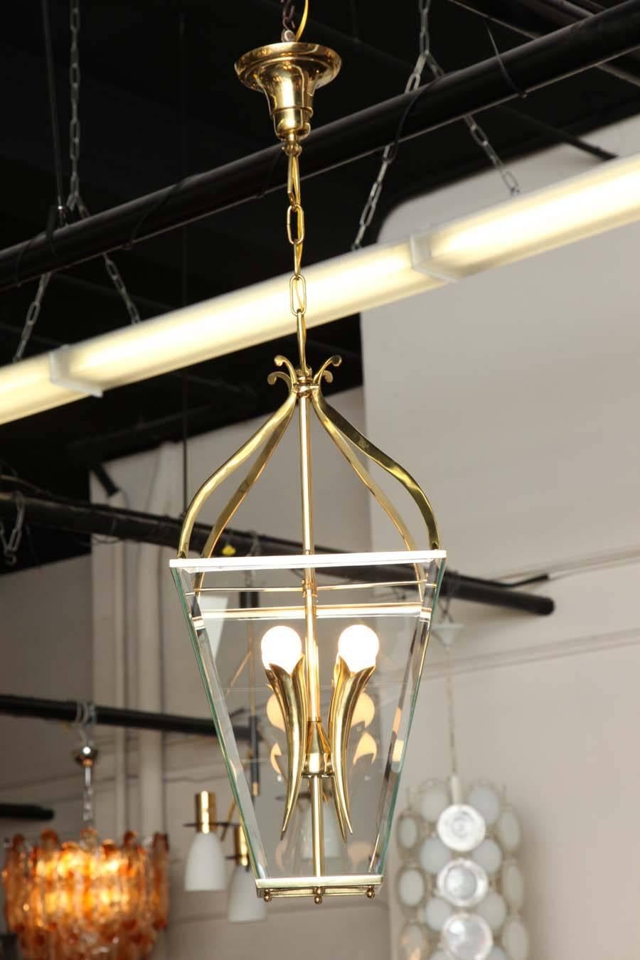 Stylish lantern chandelier made in Milan, 1940 by Brusotti, beautifully made brass frame with four cornucopias with beveled glass, very unusual. 