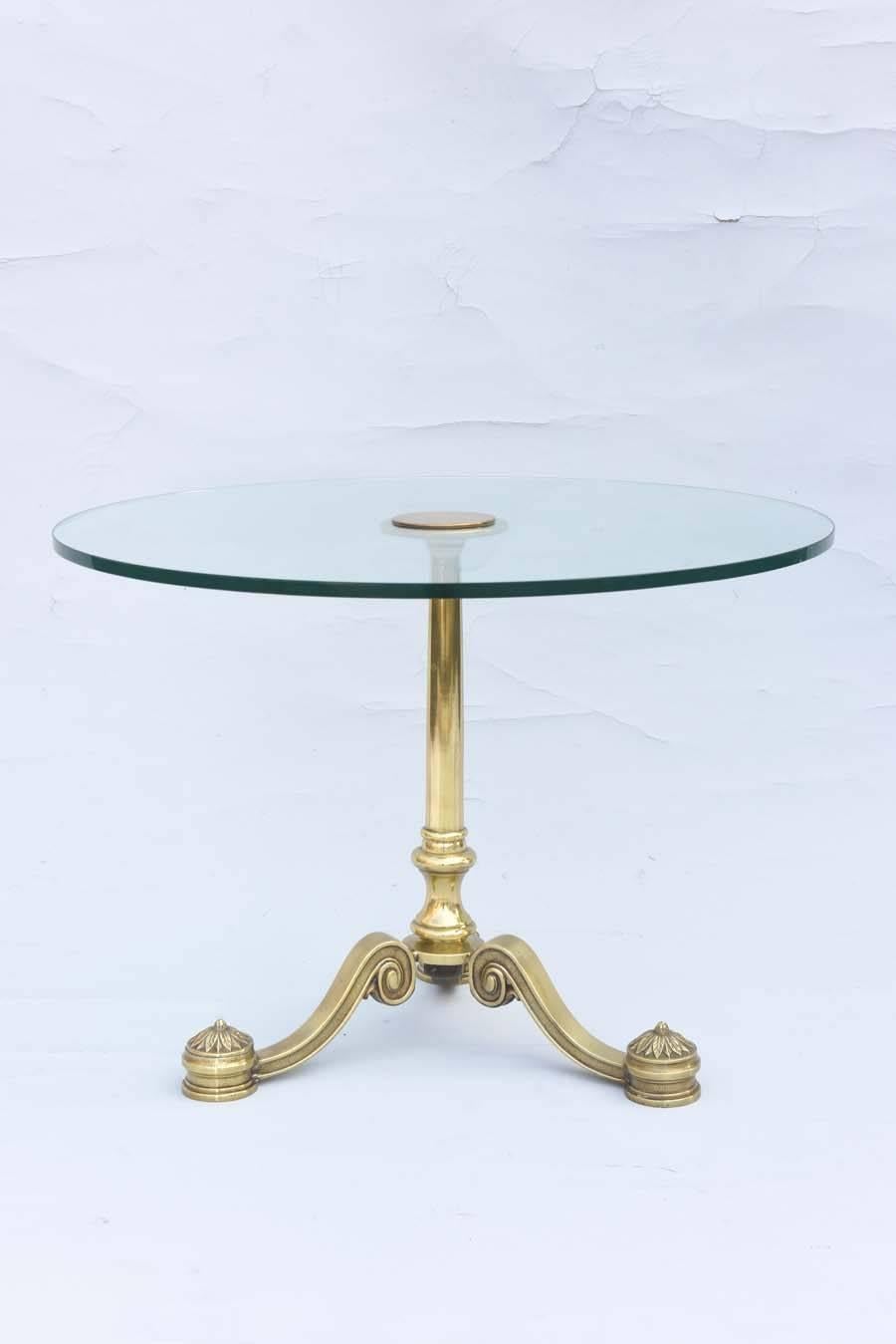Accent table, having a round top of glass, on column pedestal, raised on three splayed legs, decorated with scrolls and rosettes.

Stock ID: D6753