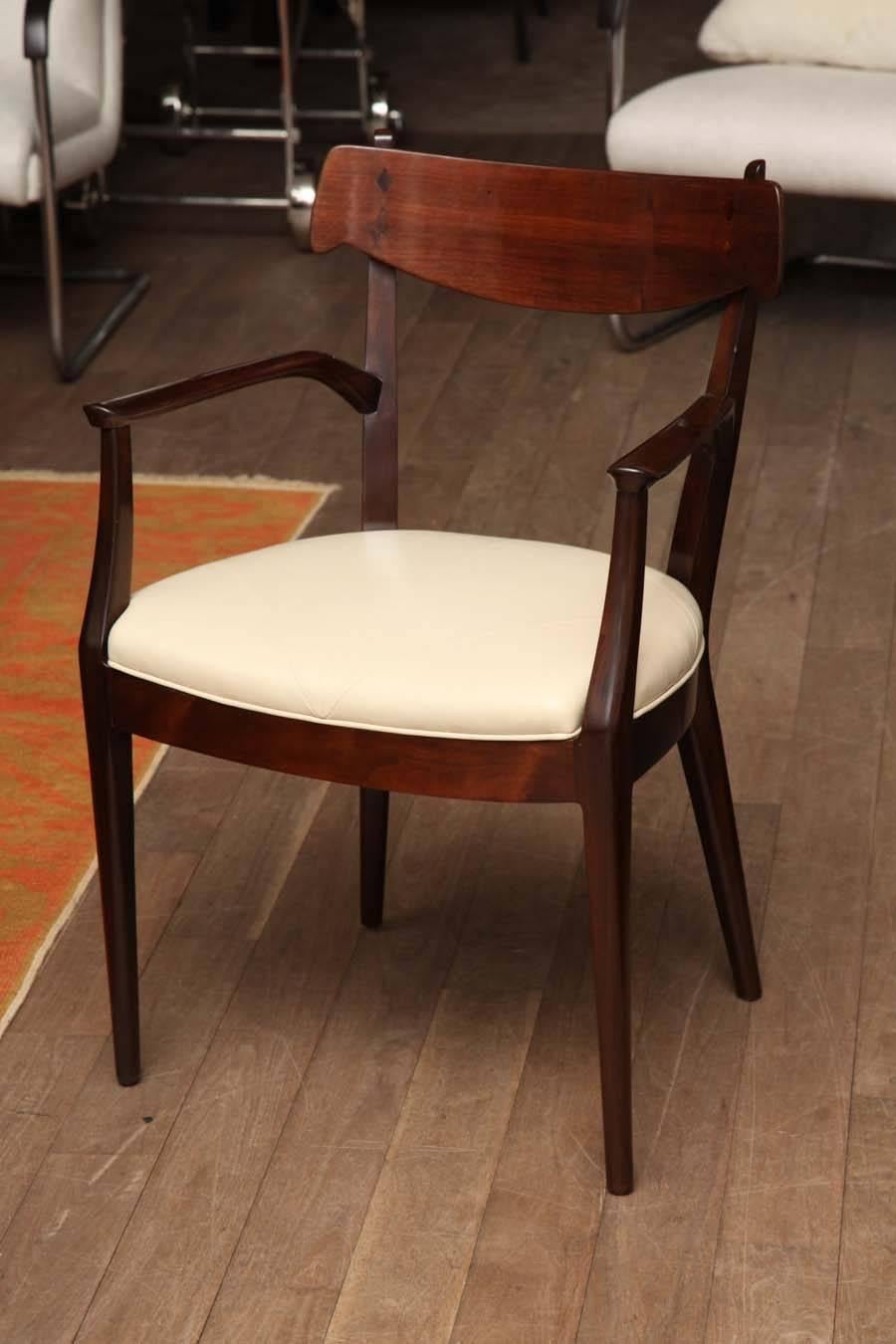 Set of six walnut dining chairs by Kip Stewart for Drexel, circa 1950, refinished and reupholstered with Danish, inspired diamond-paneled bone leather seats, two arm, four side.