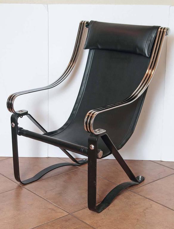  Machine Age Art Deco McKay Craft  Cantilevered Sling Lounge Chair McKaycraft

You see them occasionally, but rarely in this form.

High-back version, with ultra-wide chromed arms and iron base, and rare scrolled-down arm design.
With all four large
