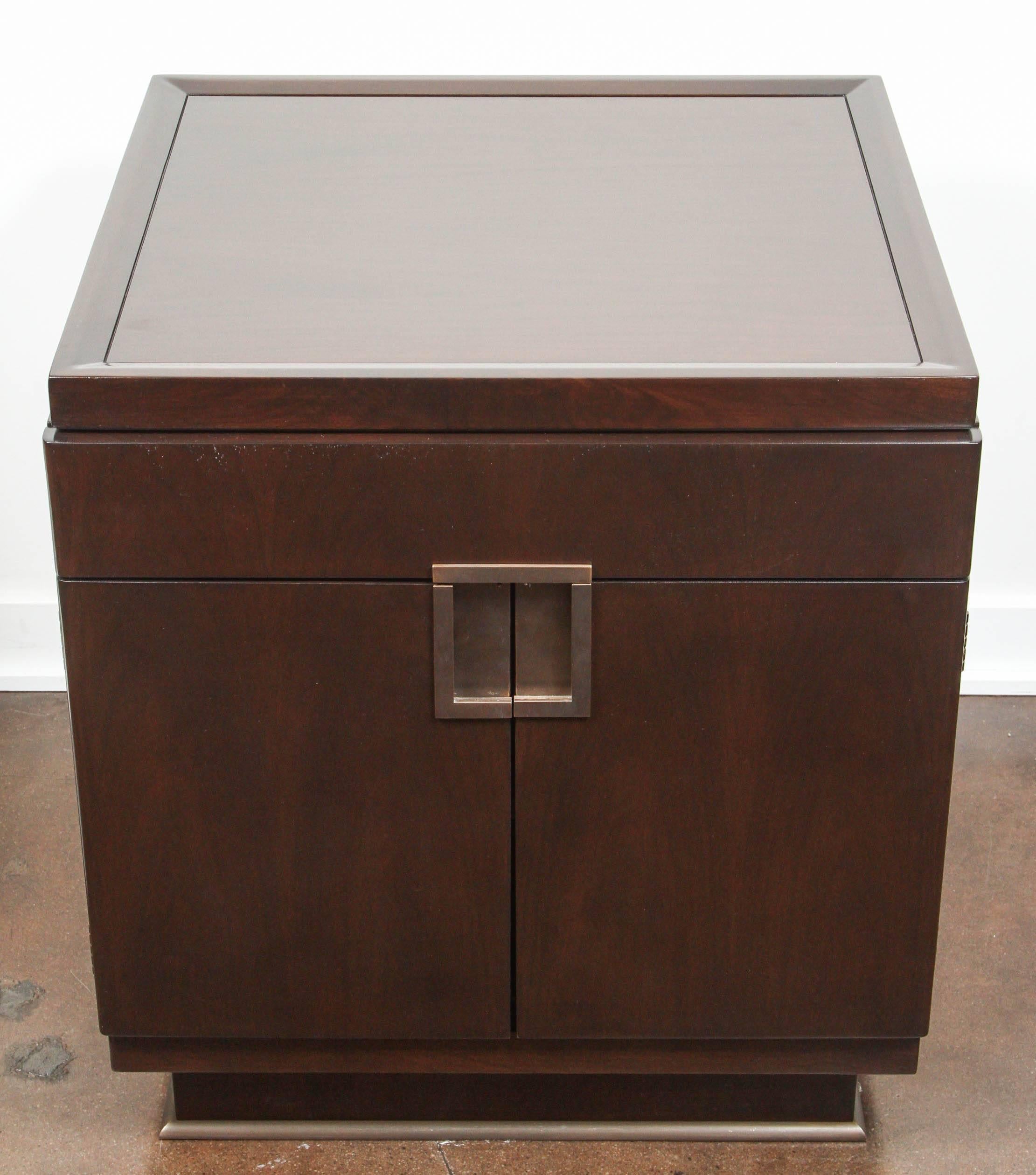 Handsome pair of large boxer chests designed by William Sofield for Baker Furniture.

The chests are in beautiful condition, made of solid American black walnut with polished bronze fittings and handles. They sit on bronze plinth bases.

  
