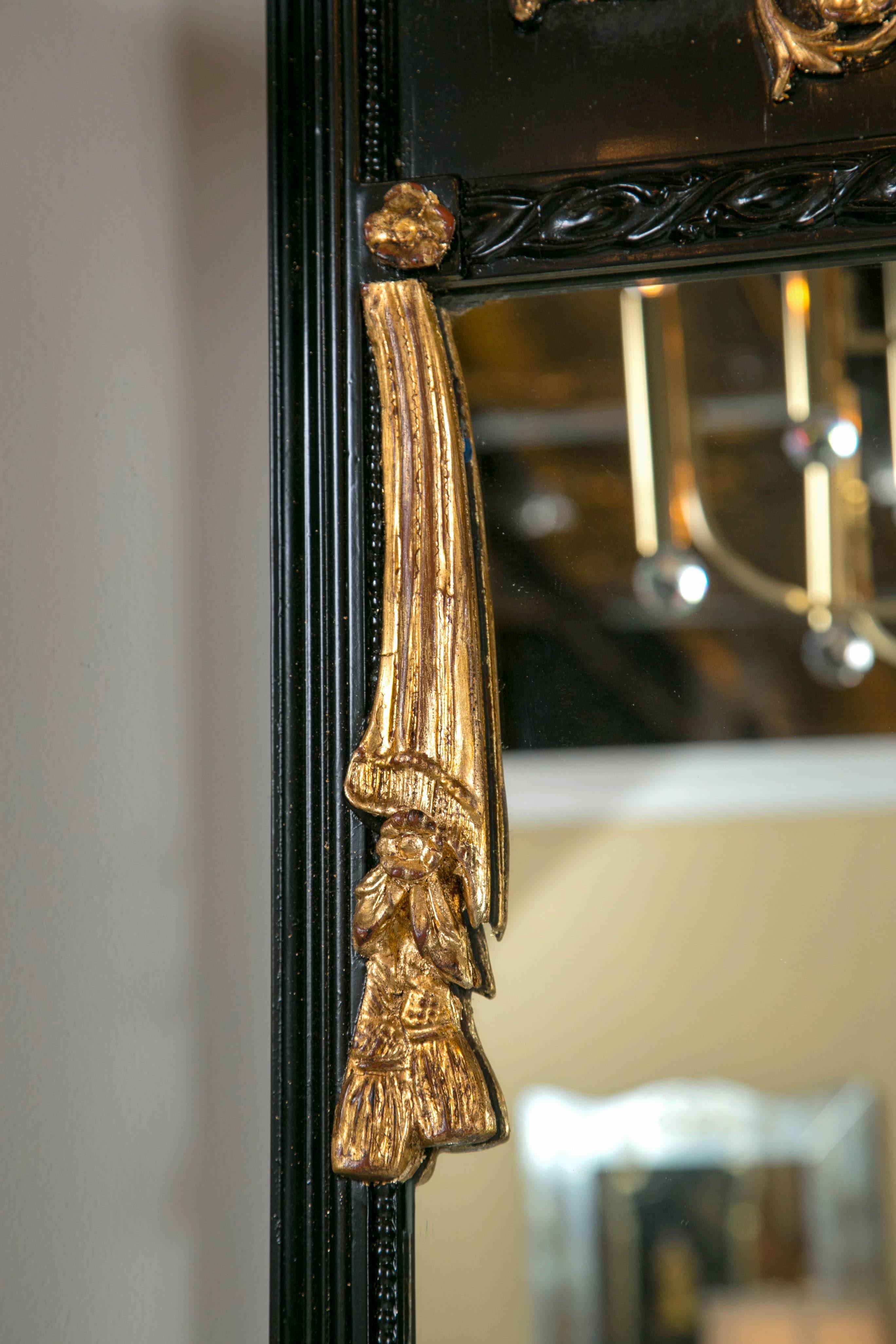 American Pair of Ebonized Gilt Drapery Form Carved Trumeau Mirrors Gilt Leaf Corners