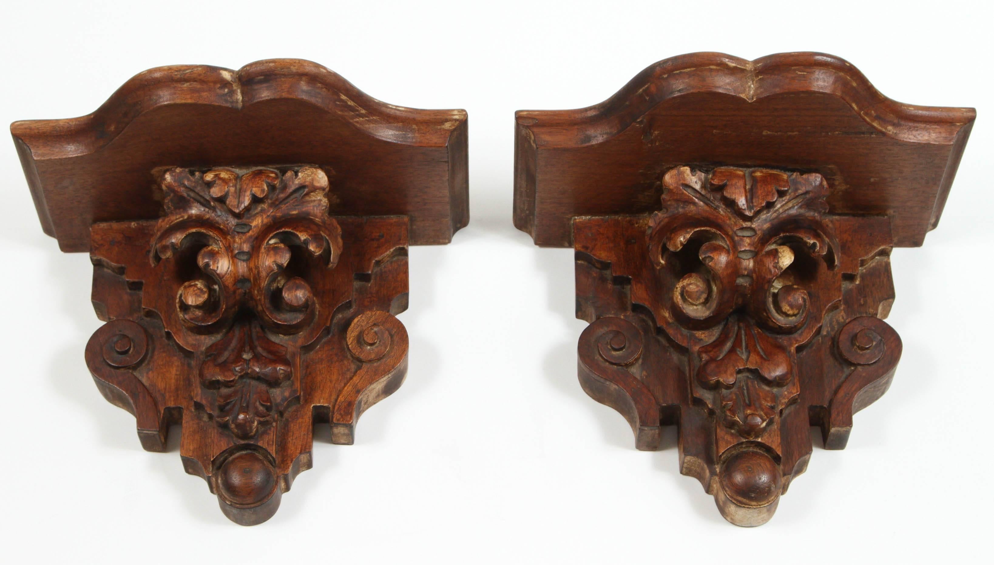 Pair of vintage hand-carved wood wall shelves. Dated 1935.