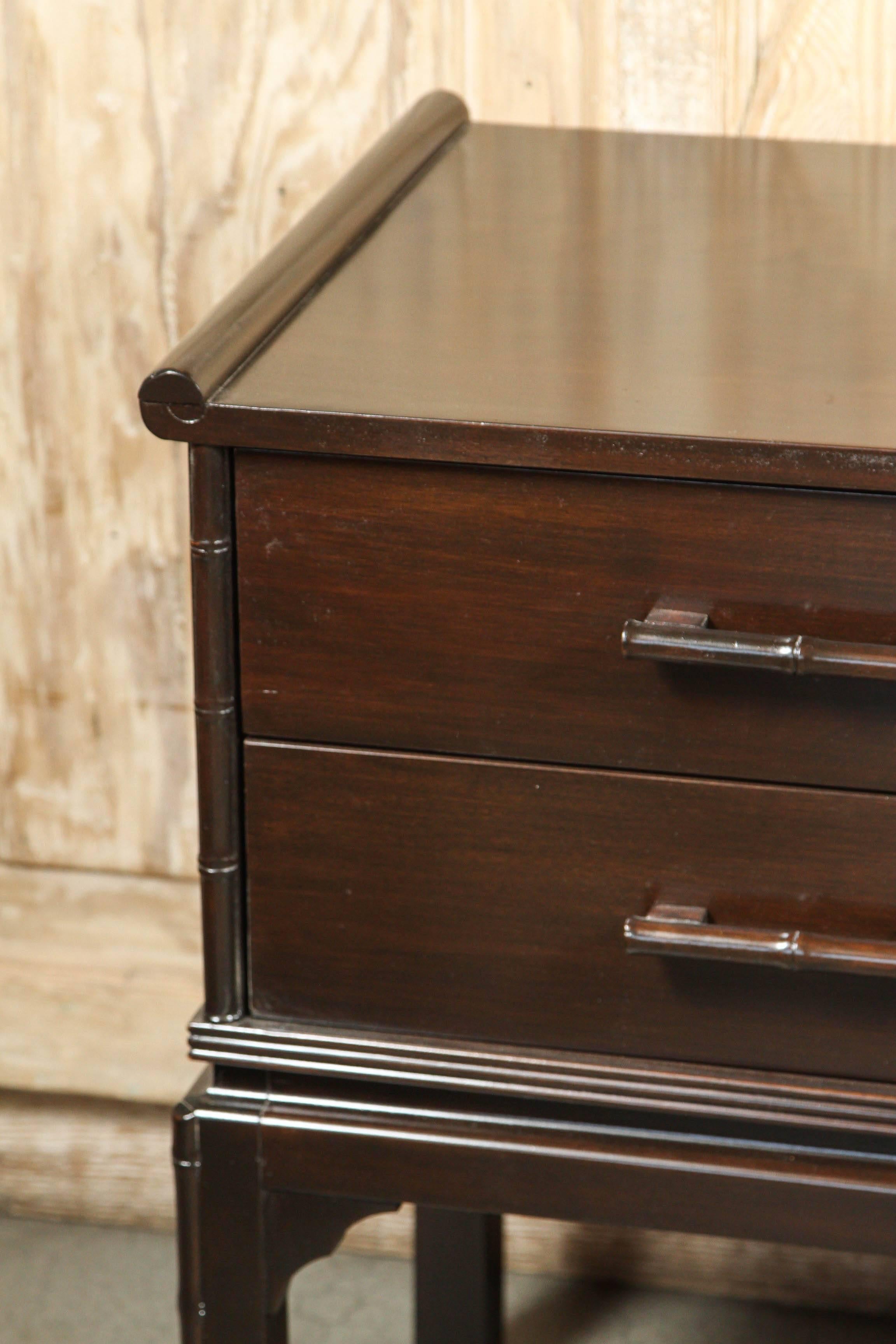 Mid-Century four-drawer console with faux bamboo details.