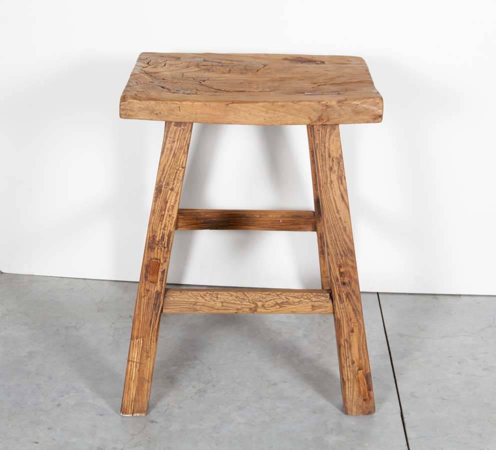 A beautifully worn tall antique Chinese stool. Also works great as a side table or pedestal. From Shanxi Province, circa 1920.
 