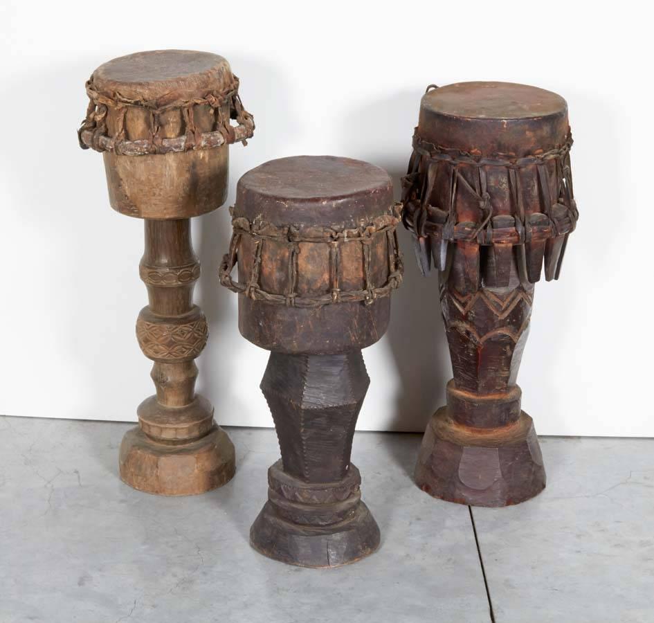 Three beautifully carved and patinated ceremonial drums from Sumba, Indonesia, circa 1930. Priced and sold individually. Sizes vary.
Left and middle drums in main image are sold. Right drum in main image is available. 
M2017.
