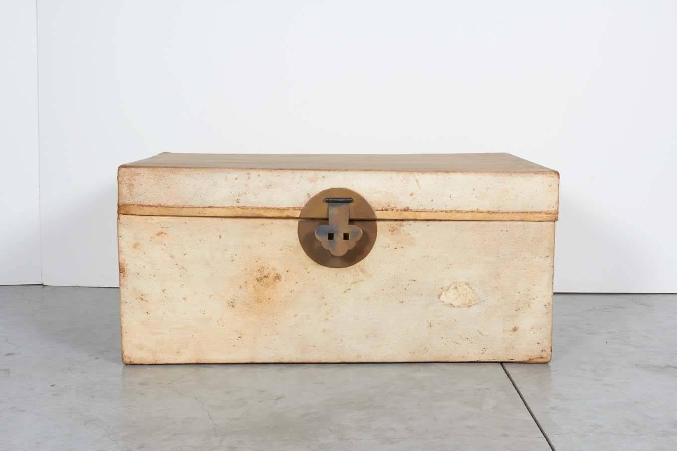 An antique Chinese parchment leather trunk with original hardware and original blue fabric interior. From Shanghai, circa 1900.
CST355.