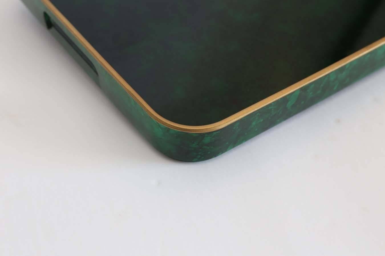 Offered is a gorgeous faux malachite with gold rim serving tray. Perfect for cocktails on a bar or decorative items in a powder bath.