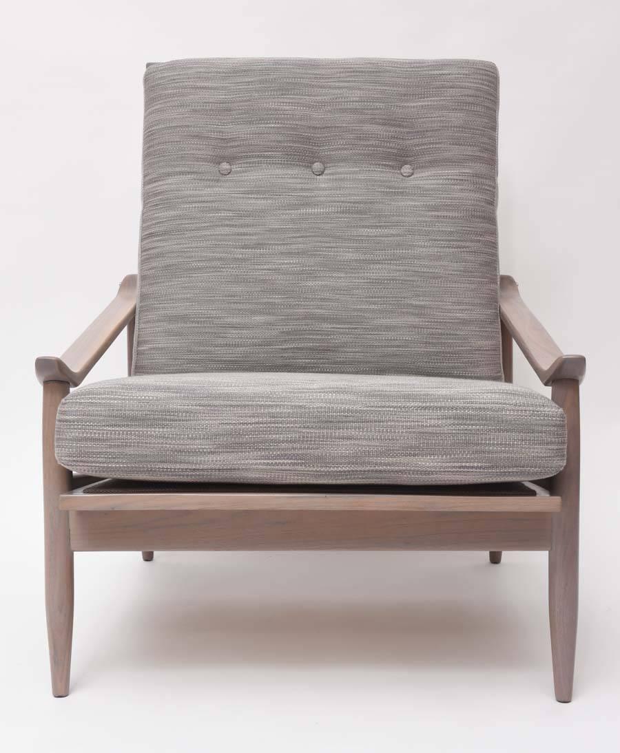 Low-slung lounge chair by Milo Baughman for Thayer Coggin with custom-finished walnut frame and new cushions upholstered in a multi-grey woven cotton fabric.