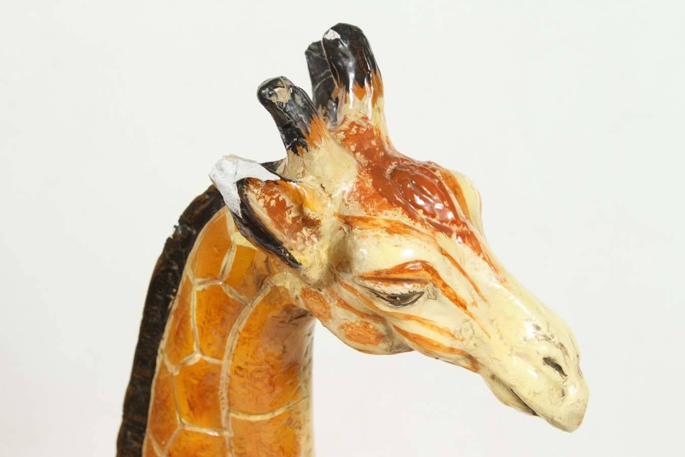 Hand-painted and glazed ceramic giraffe figurine from the 1960s.