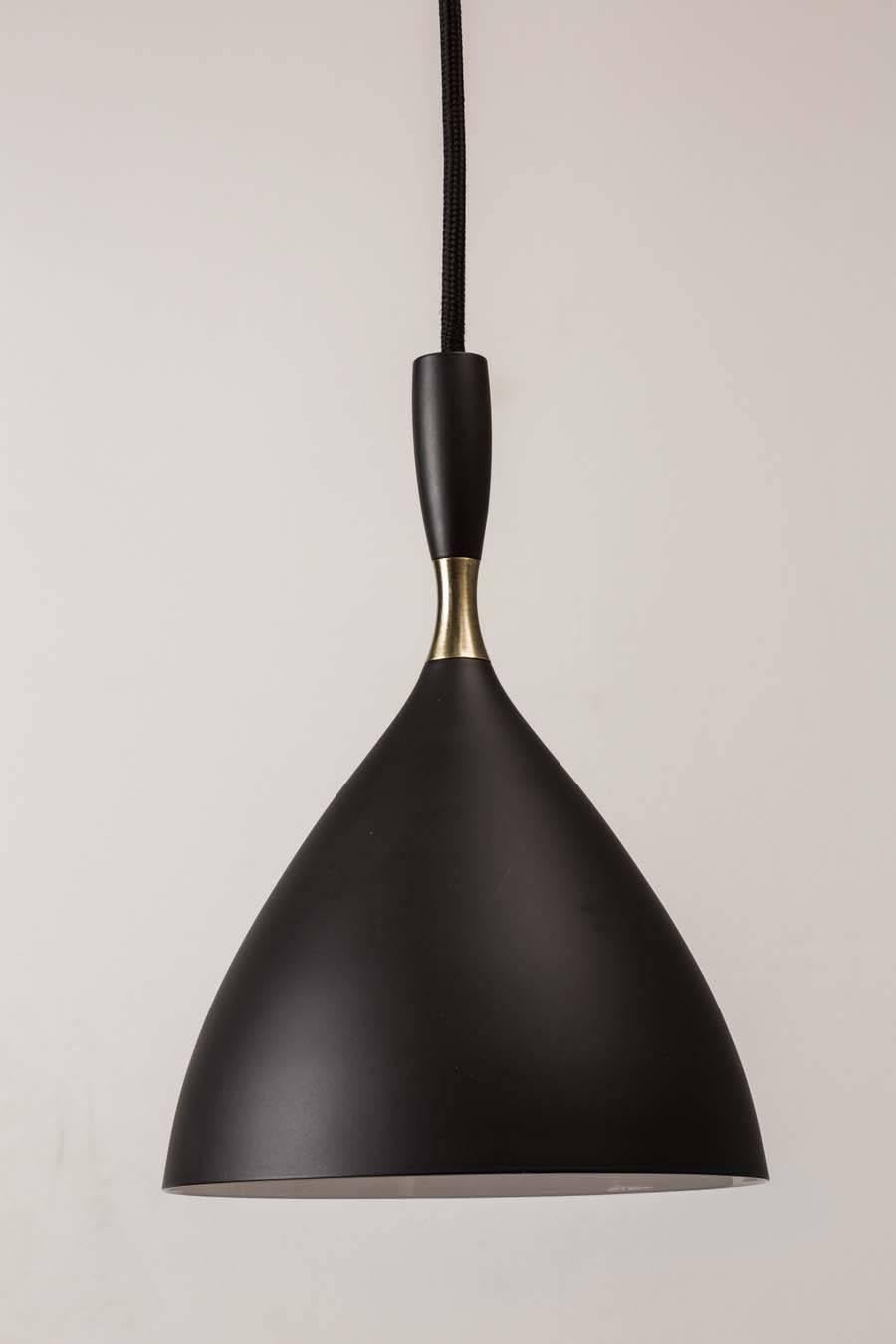 Birger Dahl pendants in the style of Stilnovo. Architectural pendant lights designed circa 1954 and executed in black enameled metal with exquisite brass detail. 36