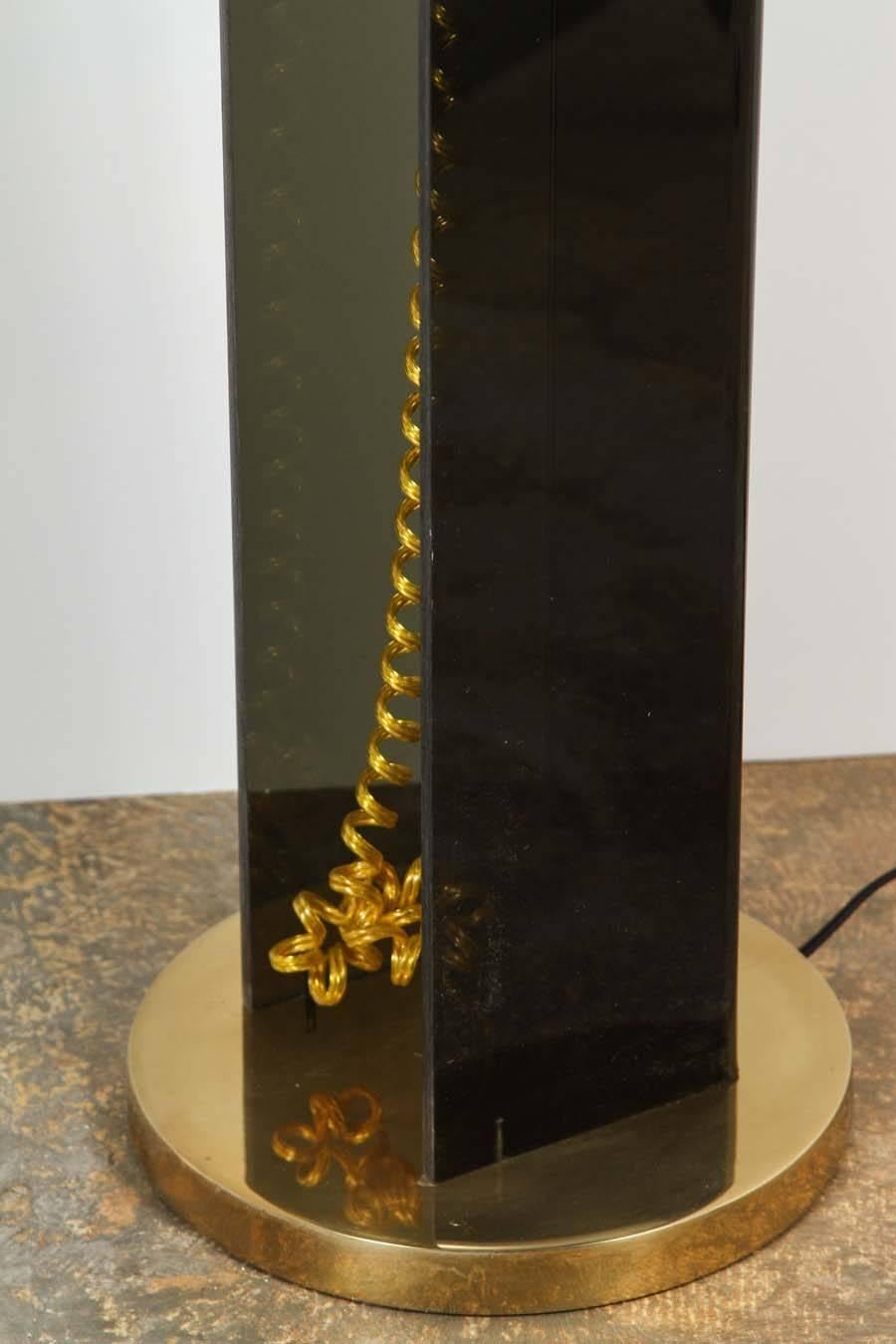 Mid-Century smoke acrylic and brass floor lamp. Restored brass and new electrical. Base is 10in. diam, length of arm is 39in., acrylic has very minor wear and scratches indicative of age.
