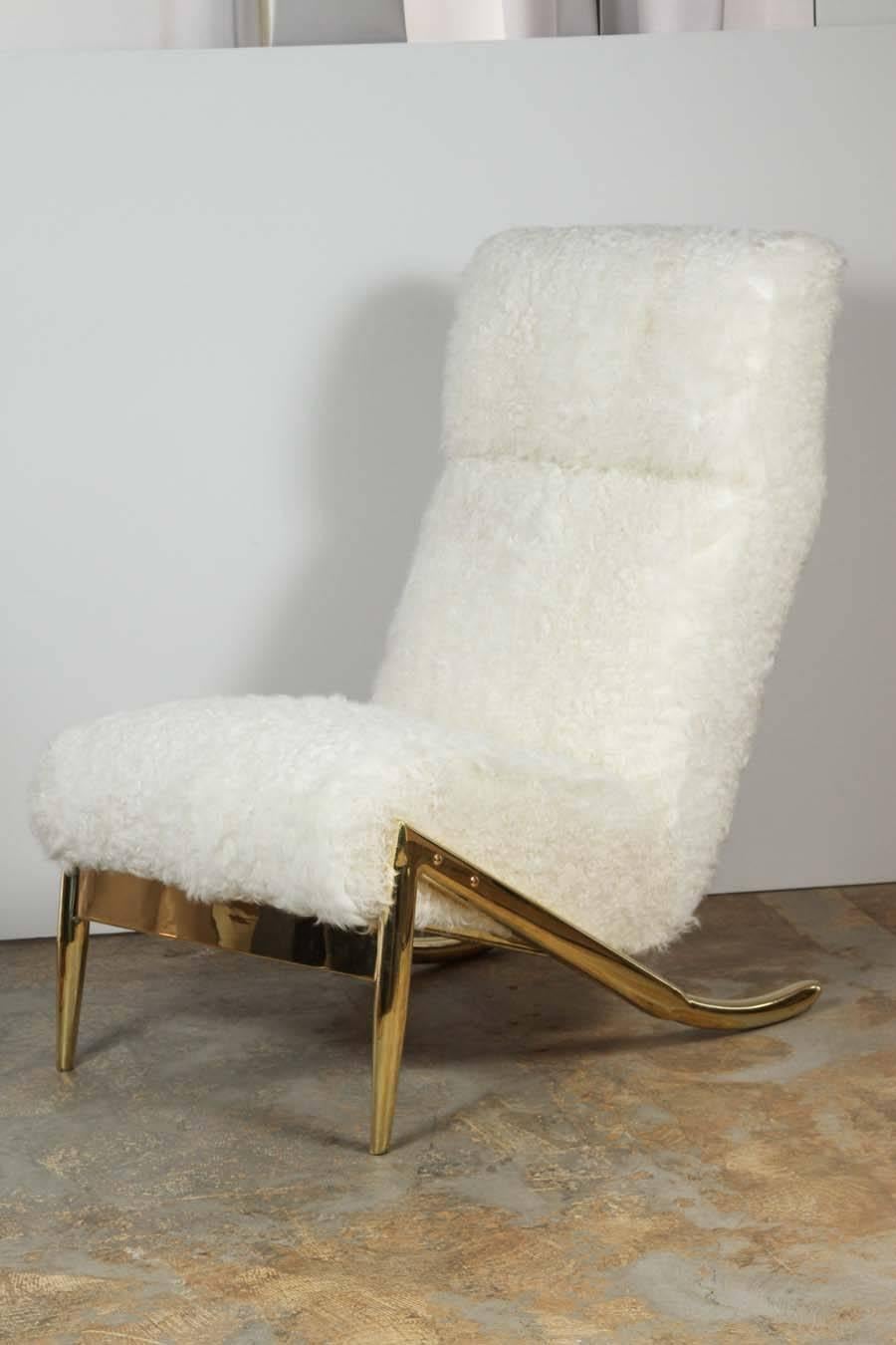 Paul Marra Slipper Chair in unlacquered polished brass and upholstered in 5 yards curly goat. Brass is unlacquered therefore will patina naturally. By order. Price quoted is per each.   ***NOTE curly goat subject to availability***