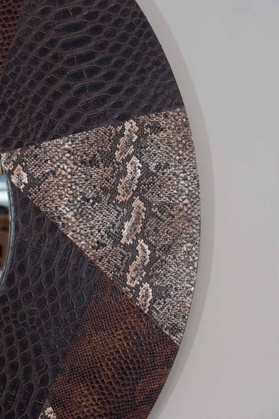 Round mirror of python embossed leather (commissioned from the Carlo Bugatti family for the movie 