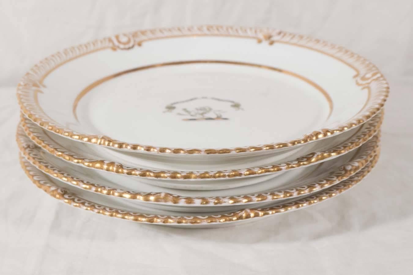 A Pair of Armorial Porcelain Plates in White and Gold In Excellent Condition In Katonah, NY